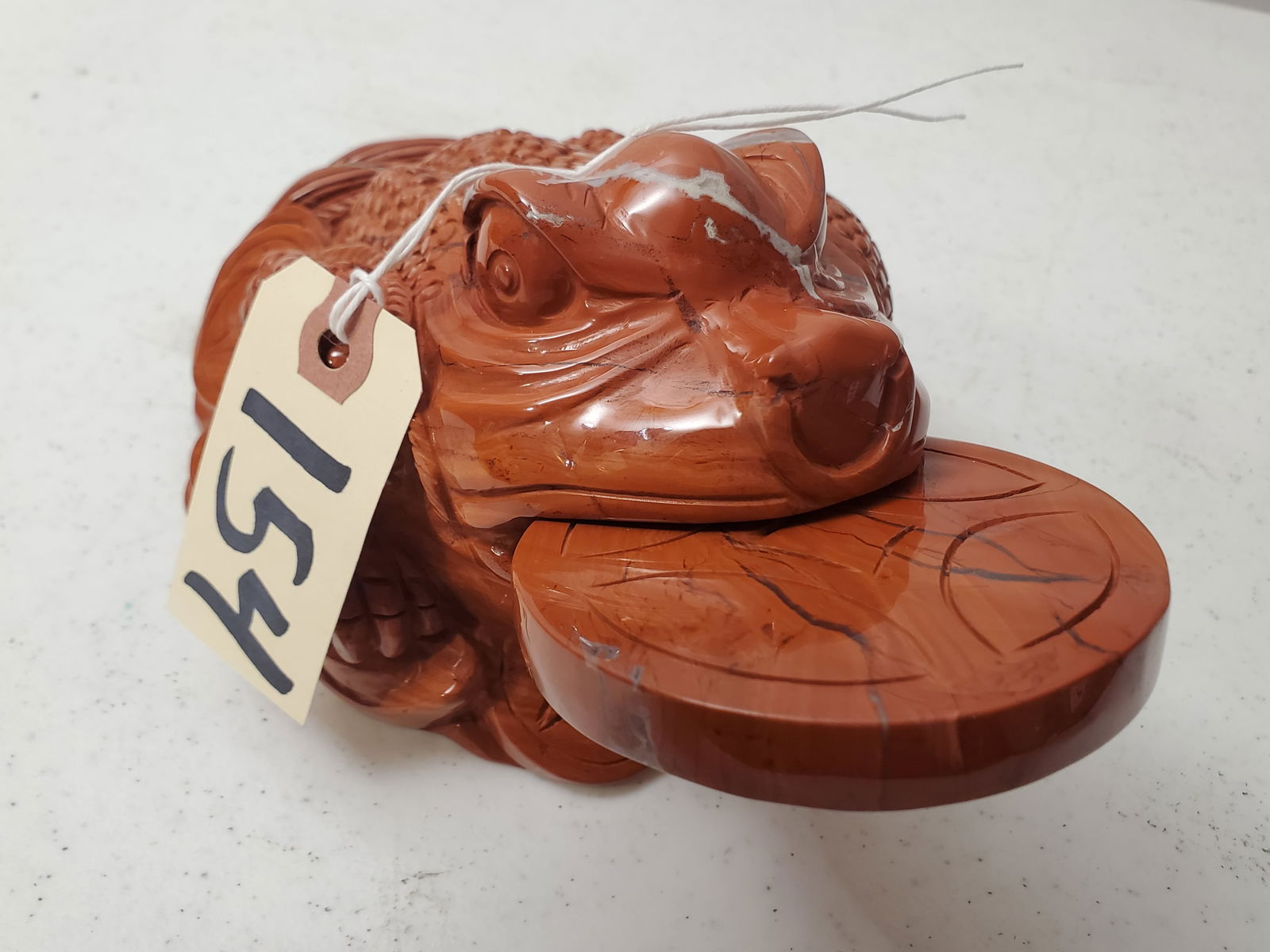 NATURAL CARVED RED AROWANA FENG SHUI MONEY TOAD FIGURAL SCULPTURE: GREAT DISPLAY OF NATURAL MINERAL CARVING WITH WONDERFUL ACCENTS THROUGHOUT AS WELL AS COLOR MEASURING 4.5 X 8