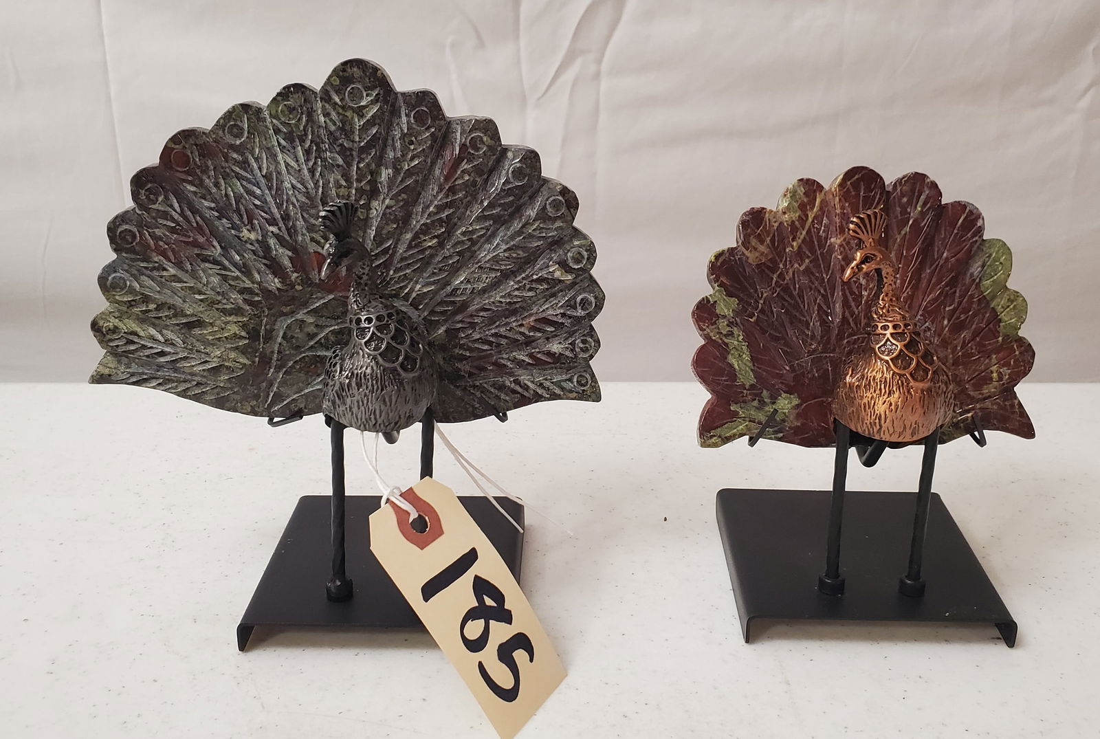 TWO NATURAL CARVED CHALCOPYRITE STONE PEACOCKS - FANBACK TAILS WITH PEWTER HEADS ON CUSTOM METAL: ONLY NATURAL FLAWS SHOWING ON STONE FANS - GREAT ORNAMENTAL PIECES - ONE IS 6.5 IN AND THE OTHER IS 5.5 IN