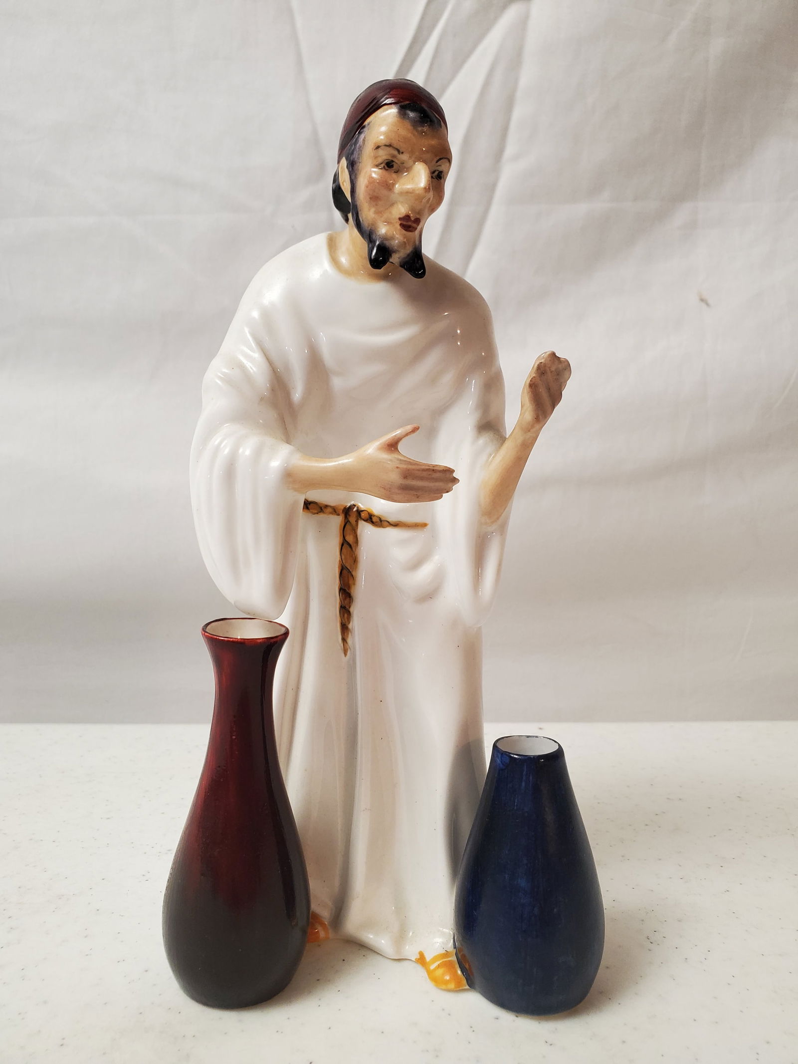 STAFFORDSHIRE POT SELLER PORCELAIN FIGURINE: SHOWING NO CRACKS, CHIPS, OR BREAKS. MEASURING 8" HIGH AND 4" WIDE