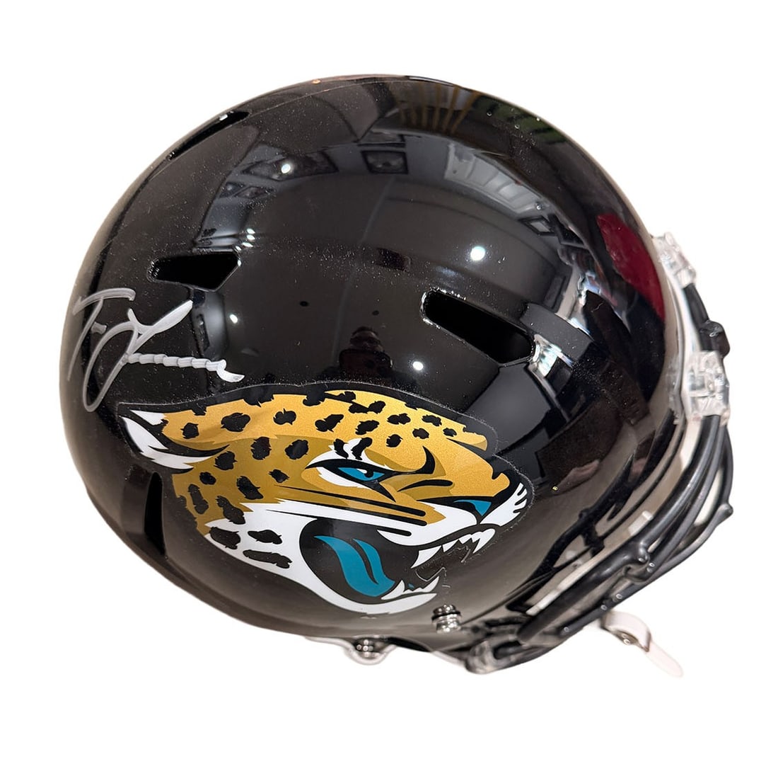 Trevor Lawrence Autographed NFL Replica Full Size Helmet: Jags Legend signed Replica NFL Full Size Helmet Large Silver Paint Pen Autograph. Authentication-Fanactics