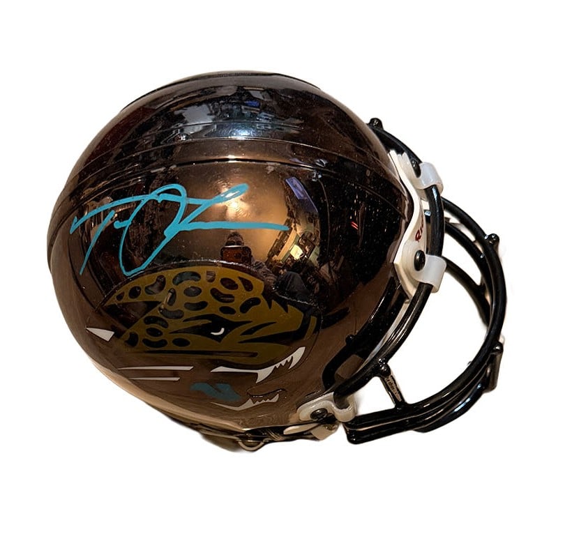 Trevor Lawrence Autographed Chrome Jags Mini Helmet: Teal Paint Pen on this Chrome Mini Helmet. Authetication- Fanactics