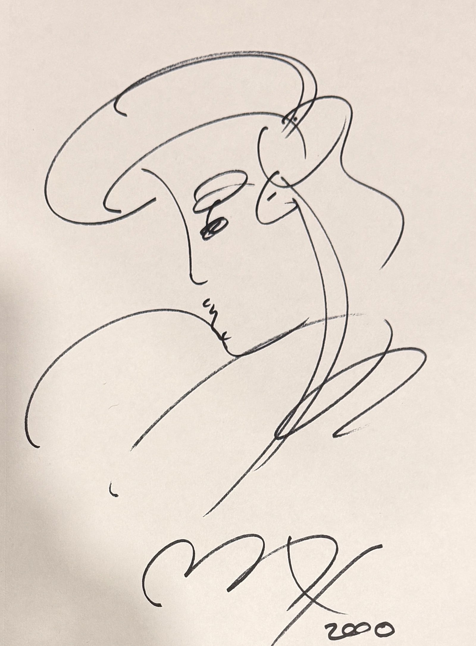 Peter Max Hand Drawn Sketch Dated 2000: Iconic Artist Peter Max Autographed and hand drawn women's face sketch 7x9 sketch in black pen.