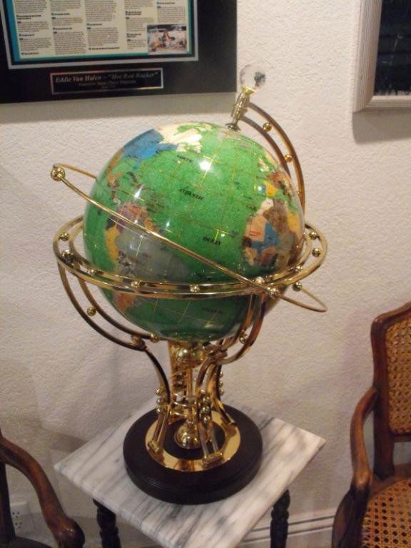World Globe w/ Gemstone Inlay: A nice gemstone inlayed world globe 12" diameter. Armillary outer ring, nice brass stand.