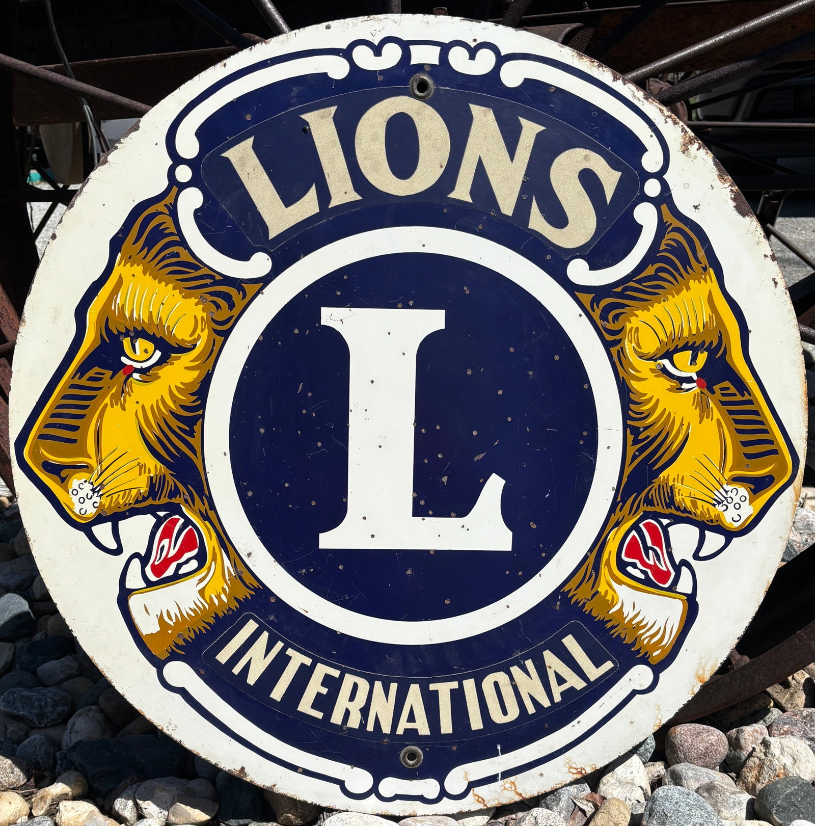 Early 29" Metal Lions International Street Sign Great Graphics: international Street Sign Great Graphics. with both brass gromets intact. 1 sided sign. Would have hung on a street pole. Displays well. some age wear see pics. Colors are vibrant. Measures 29"