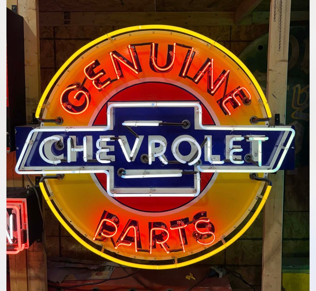 Large New Chevrolet Genuine Parts Neon Sign: Description 42”x46 Chevrolet Genuine Parts die cut porcelain neon sign. Sign is all new. 2 new Transformers. Everything from the porcelain to the can is done the old school process. Porcelain is