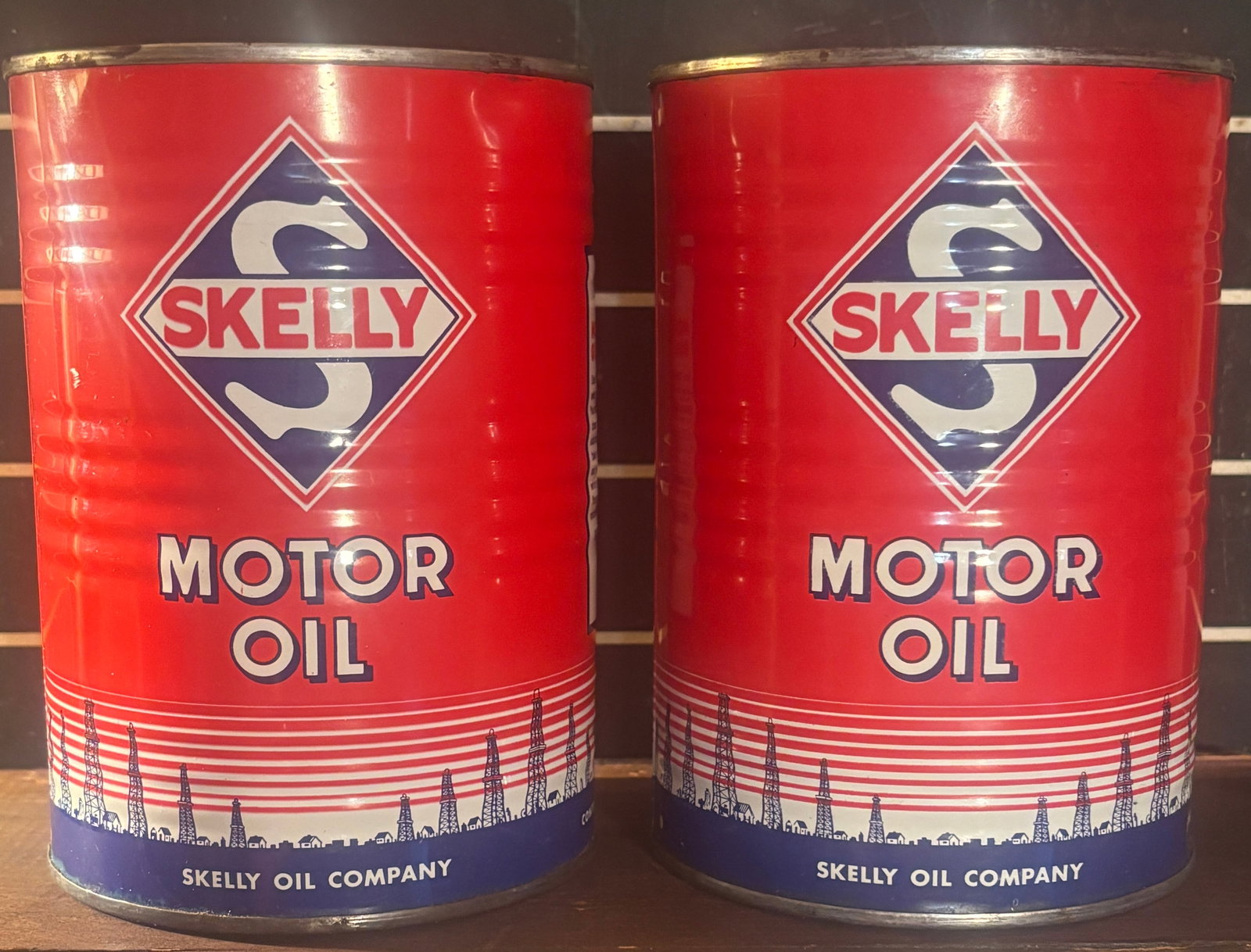 Pair of 1940s Skelly Quart Metal Motor Oil Cans: Pair of 1940s Skelly Quart Metal Motor Oil Cans, Vibrant colors! Very good condition. Featuring the red white and blue design depicting the oil derricks along the bottom. Flat rate shipping $20 or