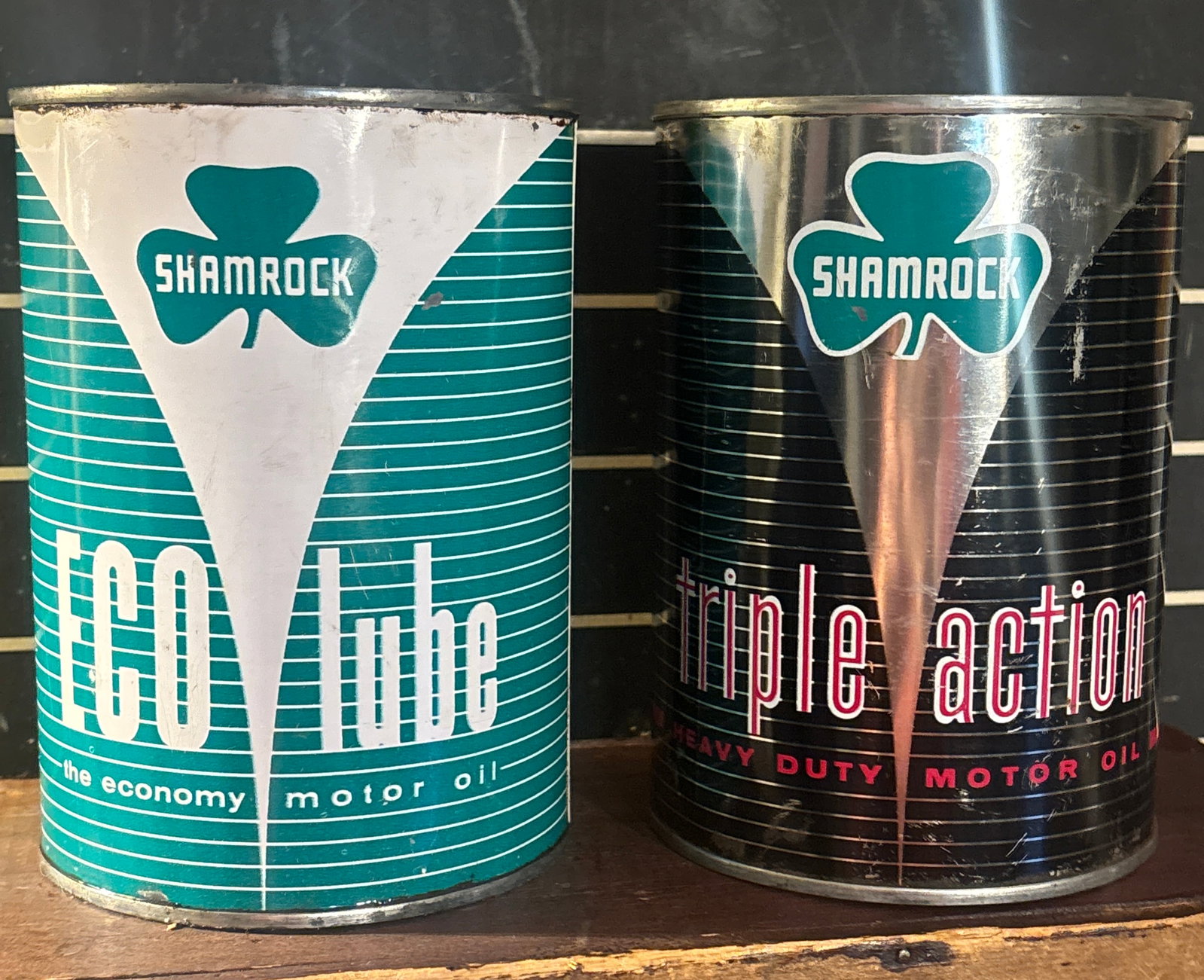 NOS Pair of Shamrock Metal motor oil Cans: Pair of Shamrock Metal motor oil Cans. Eco Lube and Triple action. Cans are not perfect but display well, see pics. NOS both cans are unopened. Flat rate shipping $20 or pick up in St. Joseph Mo.