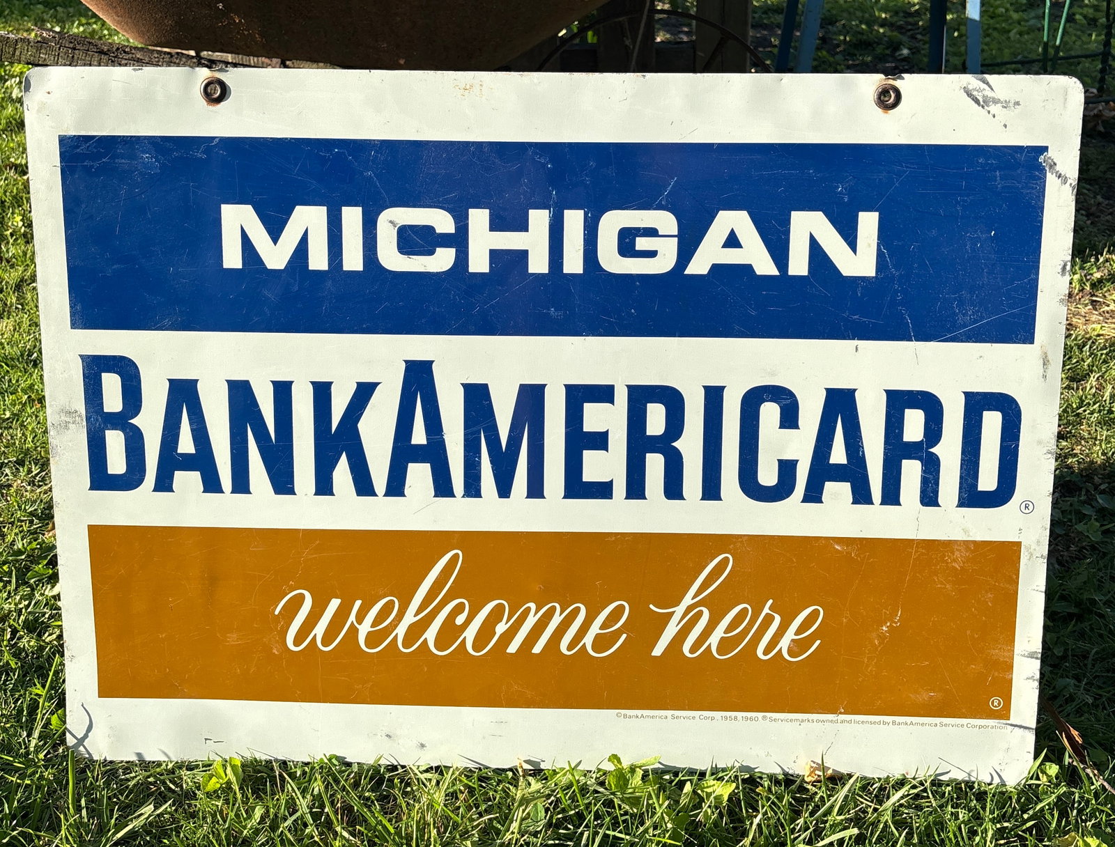 Michigan 2 sided Bank Americard Metal Sign: Michigan 2 sided Bank AmericardCard Metal Sign. Which is now Visa. Often hung outside at Gas Stations and retail stores. Has the 2 brass grommets. Displays well, see pics for condition. Flat rate