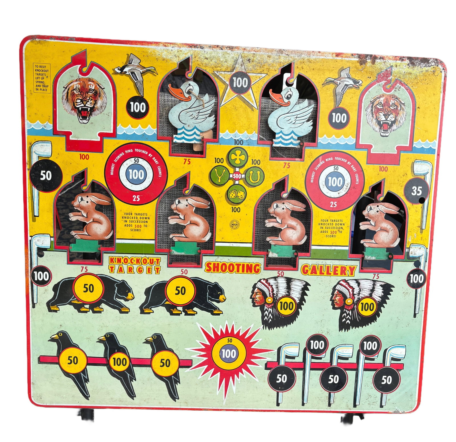 Vintage 1950s Louis Marx & Co. Tin Litho "Knockout Target": Shooting GalleryDescription:Up for auction is a highly sought-after, mid-century classic: the "Knockout Target" Shooting Gallery manufactured by the iconic Louis Marx & Co. This large-format tin litho