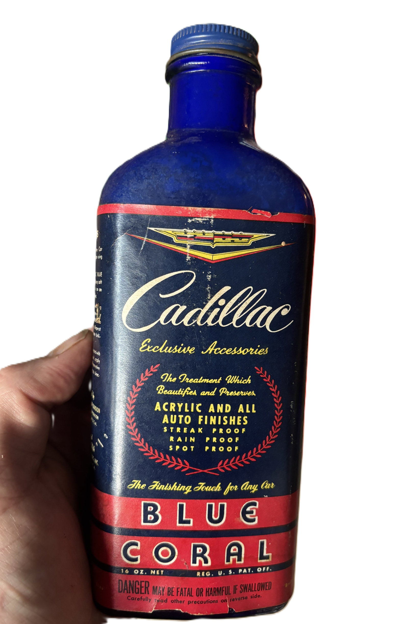 1940s 50s Cadillac Blue Coral Automobile Finish Blue Cobalt Bottle: Cadillac Blue Coral Auto Finish BottleEra: Circa 1940s–1950sOrigin: Blue Coral Company, Chicago, Illinois. Cobalt glass with gold script label. A striking example of mid-century automotive luxury, t