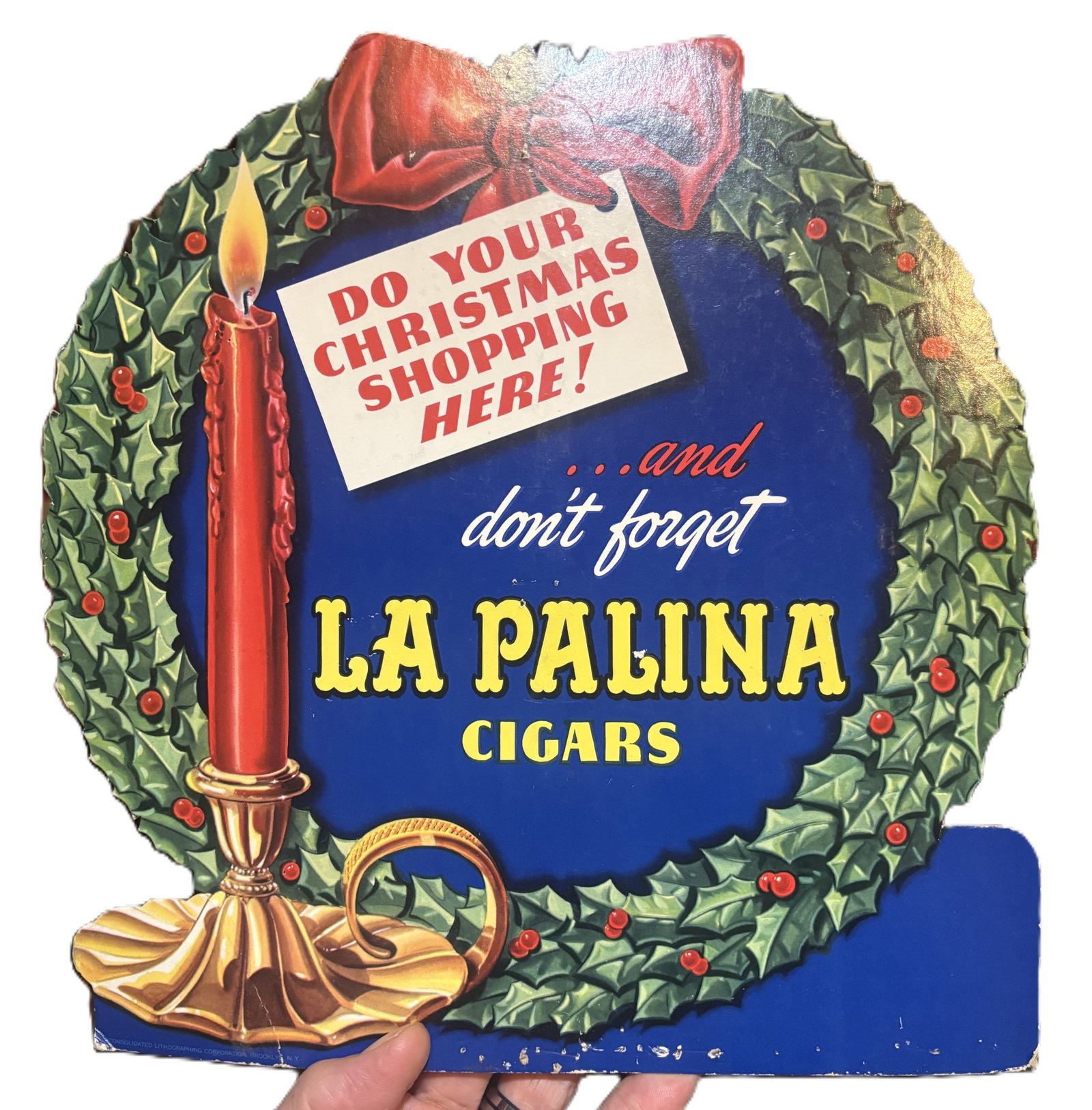 1940s 50s La Palina Cigars Christmas Store Counter Display Easel Back: Era: Circa 1940s–1950s. Lithographed cardboard with easel back. Approx.10×12 La Palina Cigars Christmas Counter Display. Vibrant holiday advertising die cut featuring a red candle, holly wreath, an