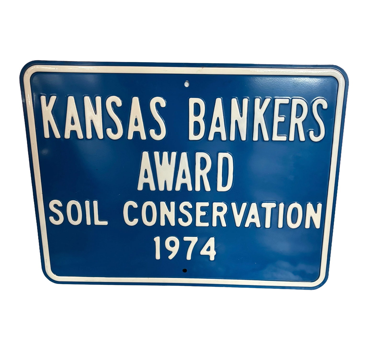 1974 Kansas Bankers Association Heavily Embossed Metal Farm Sign: This vintage Heavily embossed metal sign from 1974 is a Kansas Bankers Association Soil Conservation Award marker, historically presented to local landowners and farmers who demonstrated excellence in