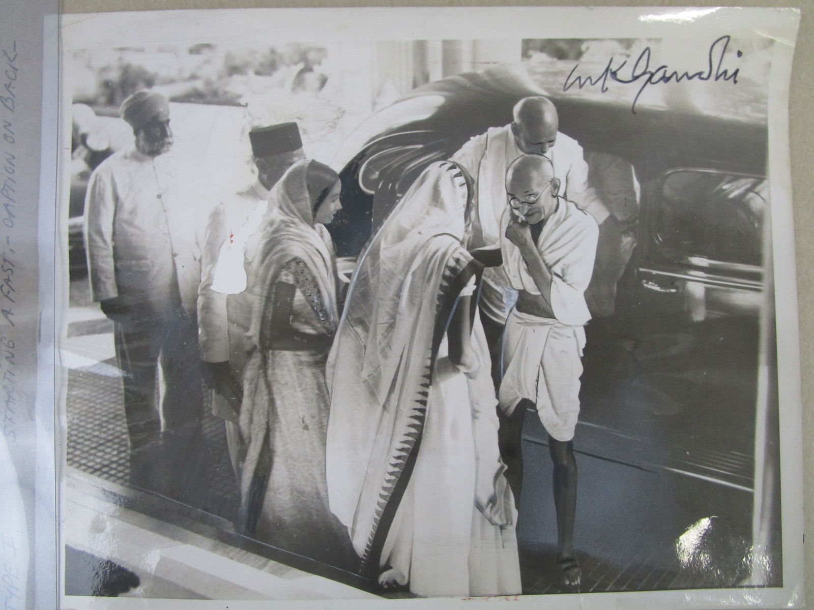 Mahatma Gandhi Signed Photograph – 9” x 7” Historic Portrait with Provenance Notation: Mahatma Gandhi Signed Photograph – 9” x 7” Historic Portrait with Provenance Notation on Reverse.Presented here is a compelling 9” x 7” photograph attributed to Mahatma Gandh
