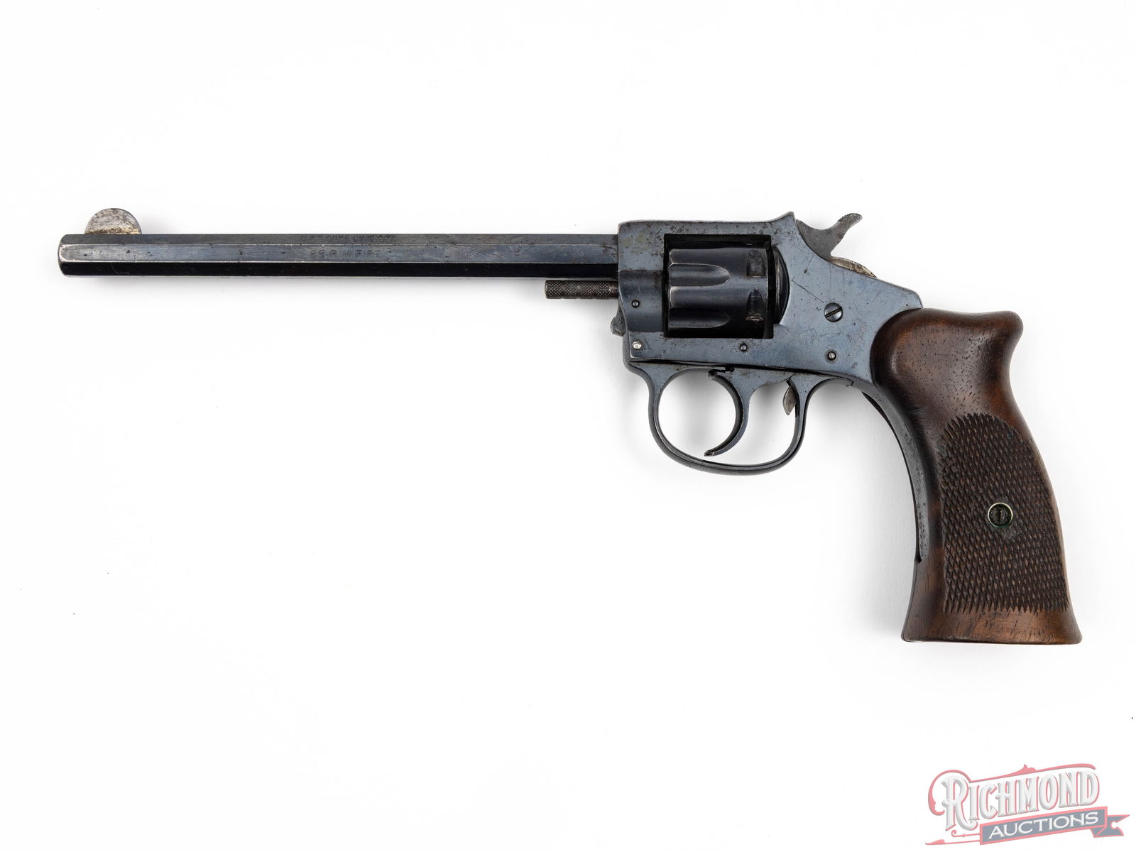 Harrington & Richardson Trapper Model .22 Rimfire 7 Shot Single / Double Action 6" Revolver: Manufactured by Harrington & Richardson circa 1915. This vintage revolver features a 6" octagon barrel with a rear notch and a half moon front blade. Single / double action with a 7 shot fluted