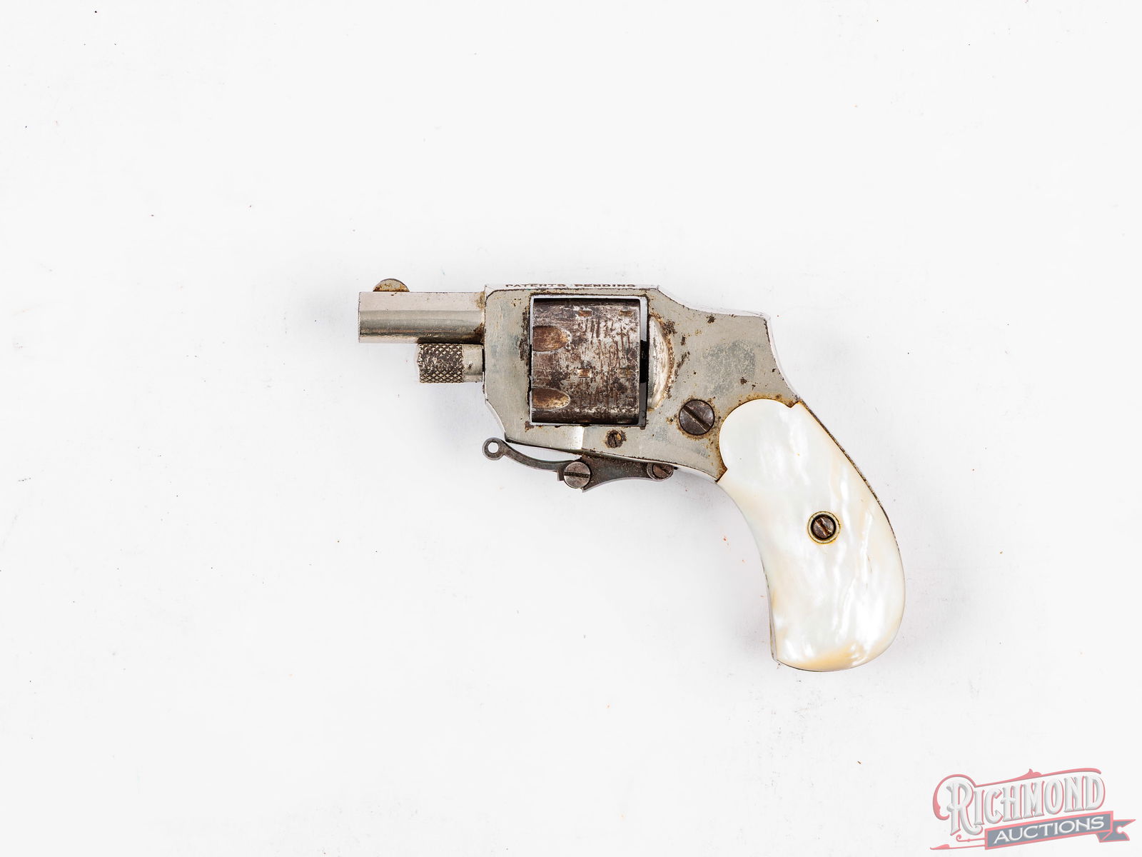 Kolb Baby Hammerless .22 Short Pocket Revolver With Folding Trigger & Mother Of Pearl Grips: Manufactured in the early 1900's. Designed by Henry Kolb, an immigrant from Germany, and given the 1910 patents for this small gun from the Columbian Firearms Manufacturing Company. Features a 1-1/4"