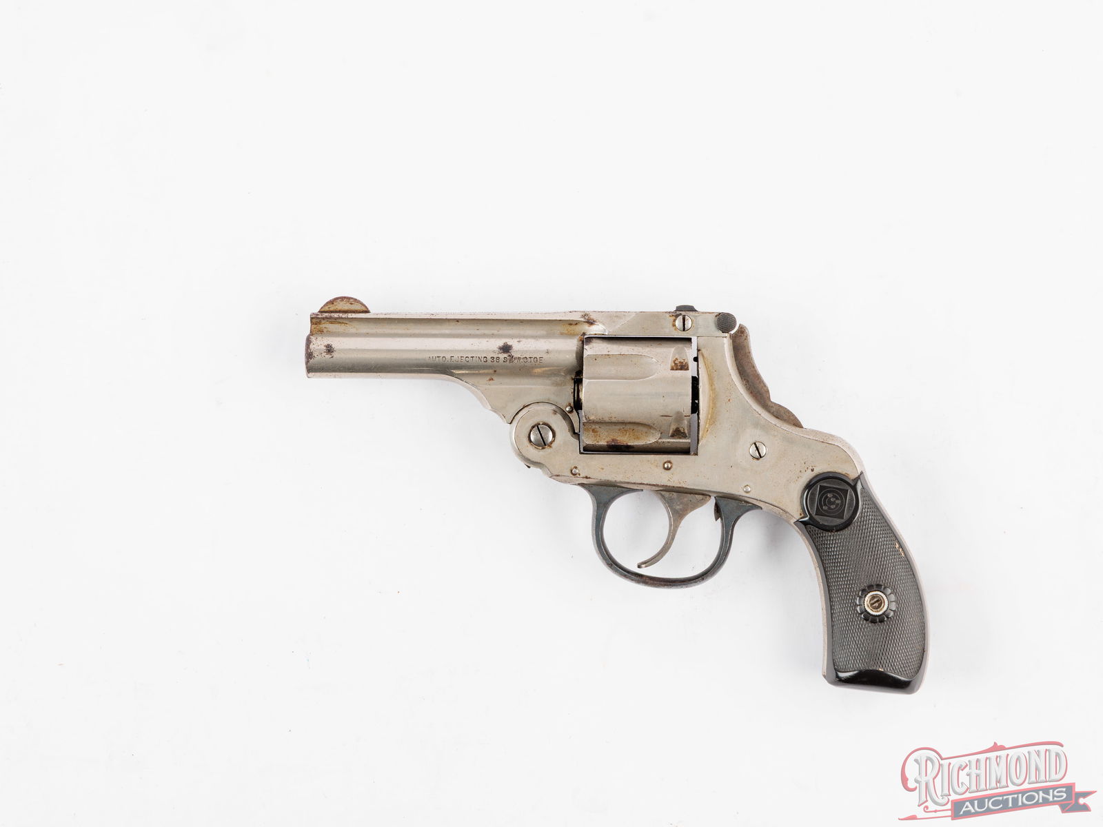 Harrington & Richardson Auto Ejecting .38 S&W Double Action Revolver in Nickel: Manufactured by Harrington & Richardson Arms circa early twentieth century. Features a 3-1/8" barrel with solid rib, rear notch and half moon front sight. Top latch, double action with a five round