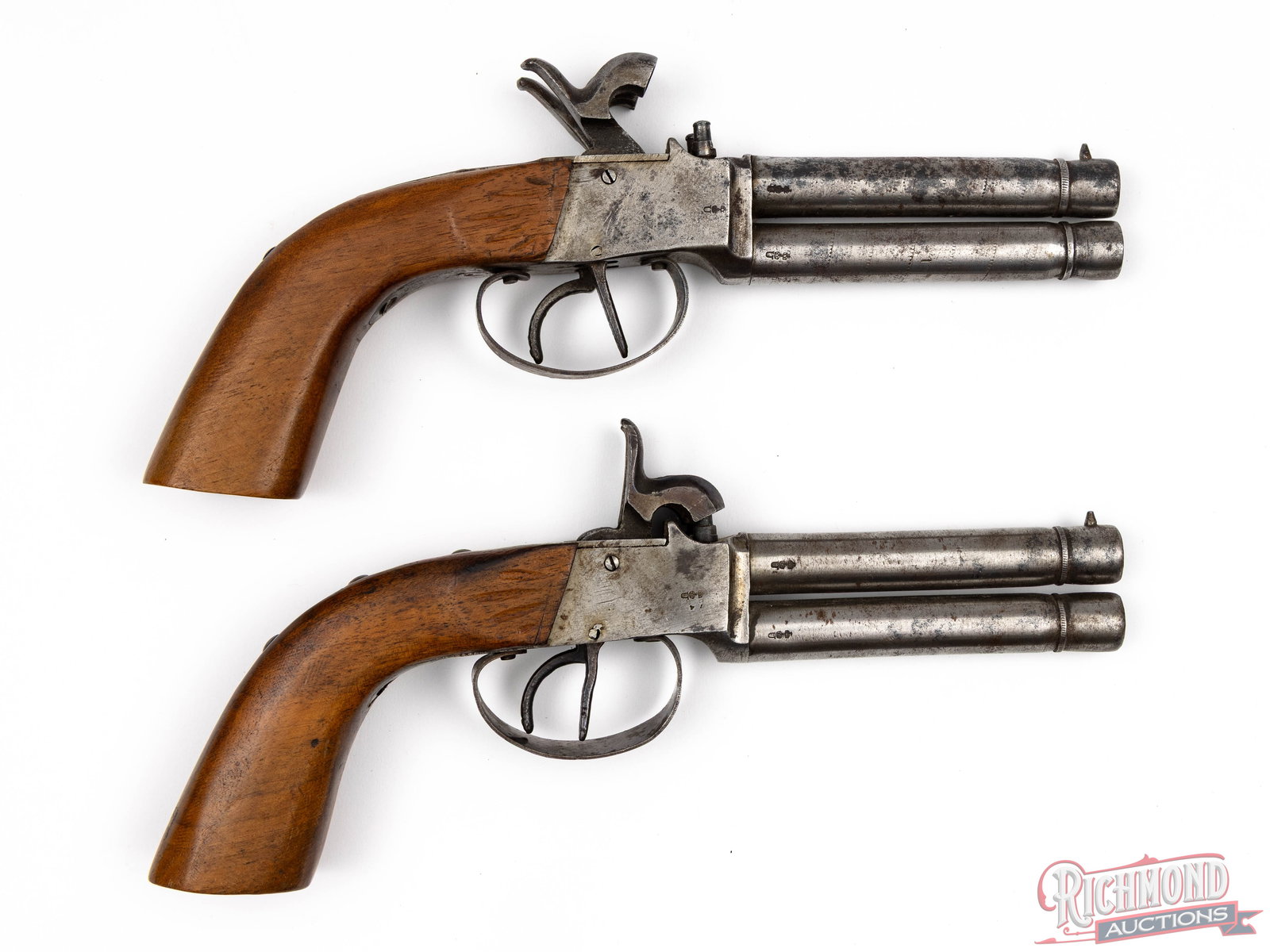 Pair of German Screw Barrel 40 Caliber Over/Under Percussion Pistols In Case: Made in Germany circa 1850 with interesting German "Crown /U" 1891 proofs long after the percussion era had ended. These pistols appear to be a pair with or at least made by the same maker with one nu