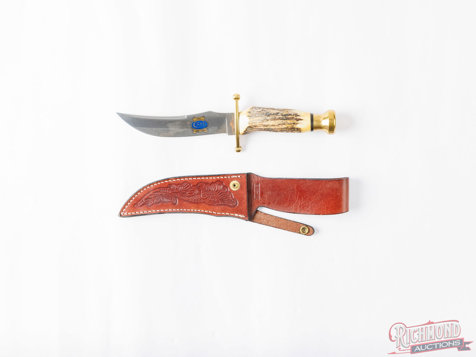 Case XX Kodiak 100th Anniversary Fixed Blade Knife in the Original Box: This Case XX is the 100th Anniversary edition Kodiak. Features a 5-1/2" trailing point blade with the Case logo and 1889-1989 100th Anniversary etched in the blade. Double brass hilt, stag handle and