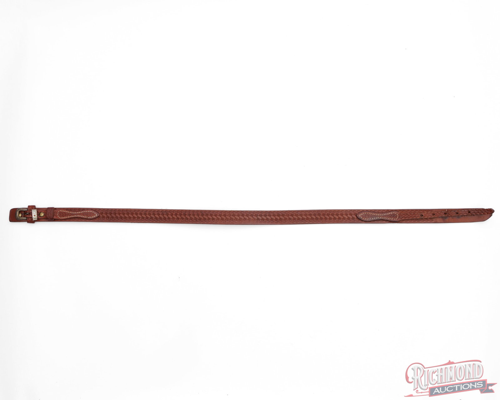 Cabela's Leather Belt 34"-38": This leather belt is adjustable for use for 34" to 38" waist. The belt measures 41" overall and has a decorated buckle with Cabela's logo stamped into the leather on the opposite end. Condition VERY