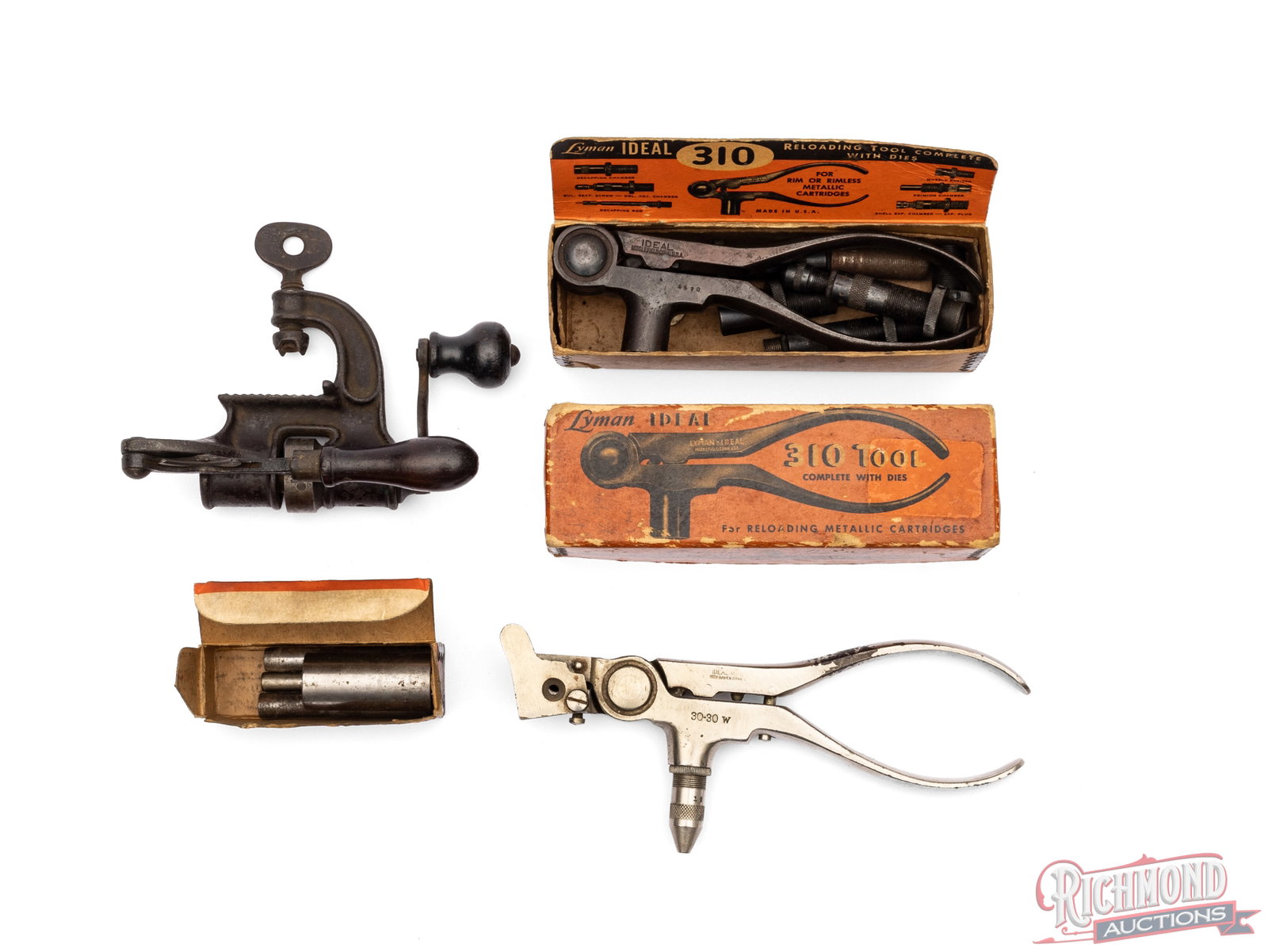 Lot of Lyman Loading Tools And Shotgun Reloading Tool: Lot includes Lyman Ideal 30-30 W Reloading tool, 45-70 re-sizing tool, 310 tong tool in 45-70 and 10 gauge shotshell reloading tool. Condition GOOD with age staining on boxes and all parts appearing t