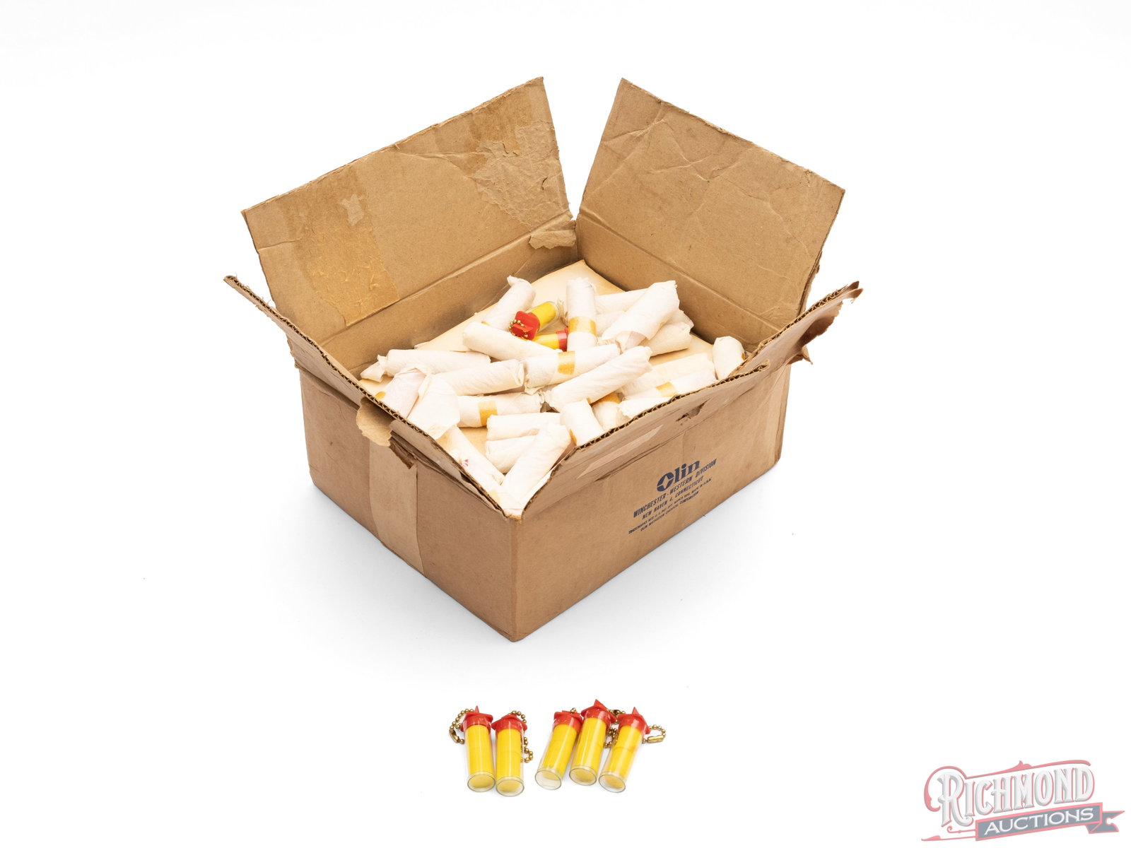 Case of Winchester Promotional Foam Earplugs: This case of earplug has the original Winchester-Western shipping label. It contains small plastic keychain containers that each contain a pair of foam earplugs. Box measures 5" x 9" x 11" and is fill