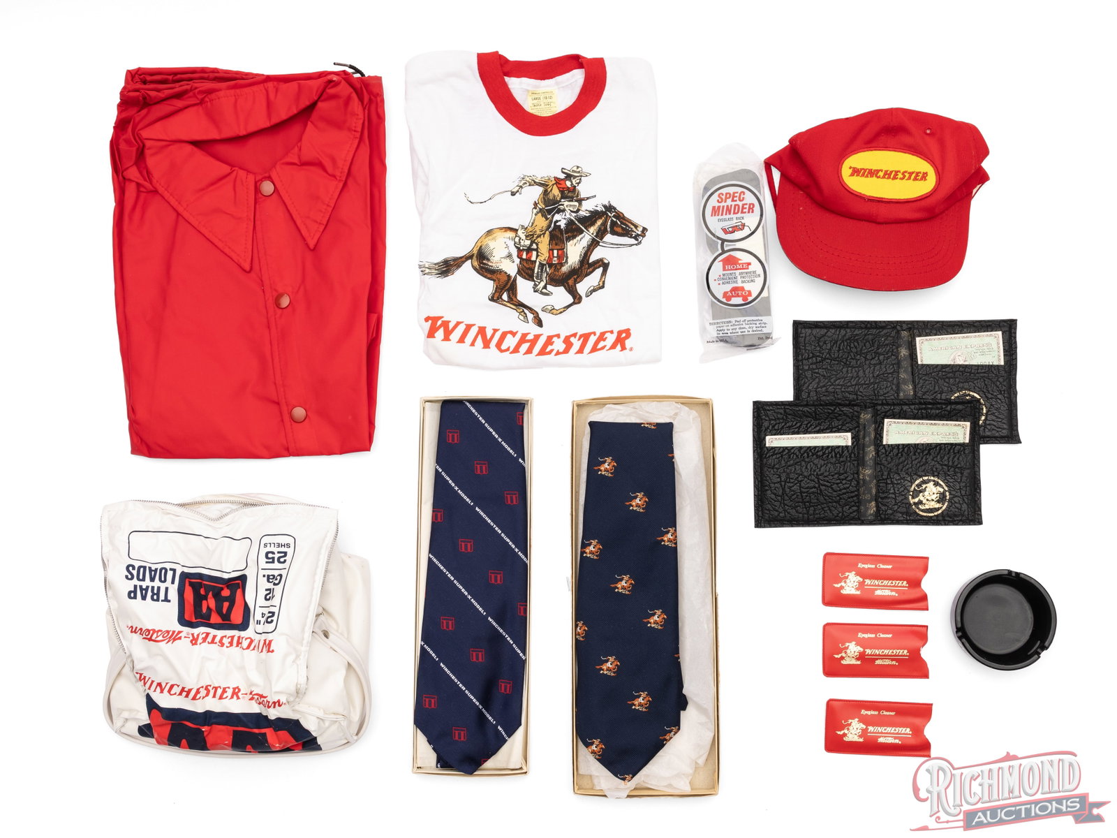 Lot of Winchester Promotional Apparel And Accessories: This is a lot of various items that was used to promote the Winchester brand. Included in this lot is an eyeglass rack, 2 leather wallets, 3 eyeglass cleaner/wipes, a soft sided "AA" cooler, Wincheste