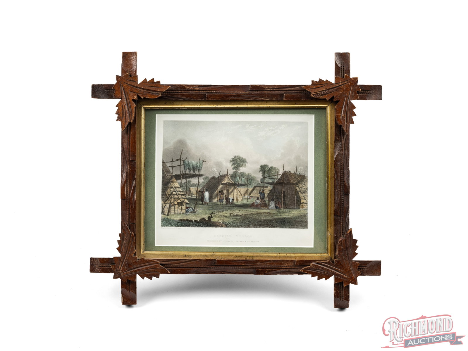 Framed Print of "Dakota Village" By Lippincott Grambo & Co: This framed print titled "Dakota Village" depicts the scene of a Native American Village. It is in a wooden frame with carved leaves on the corners and measures 13 1/2" x 15 1/2". The print has