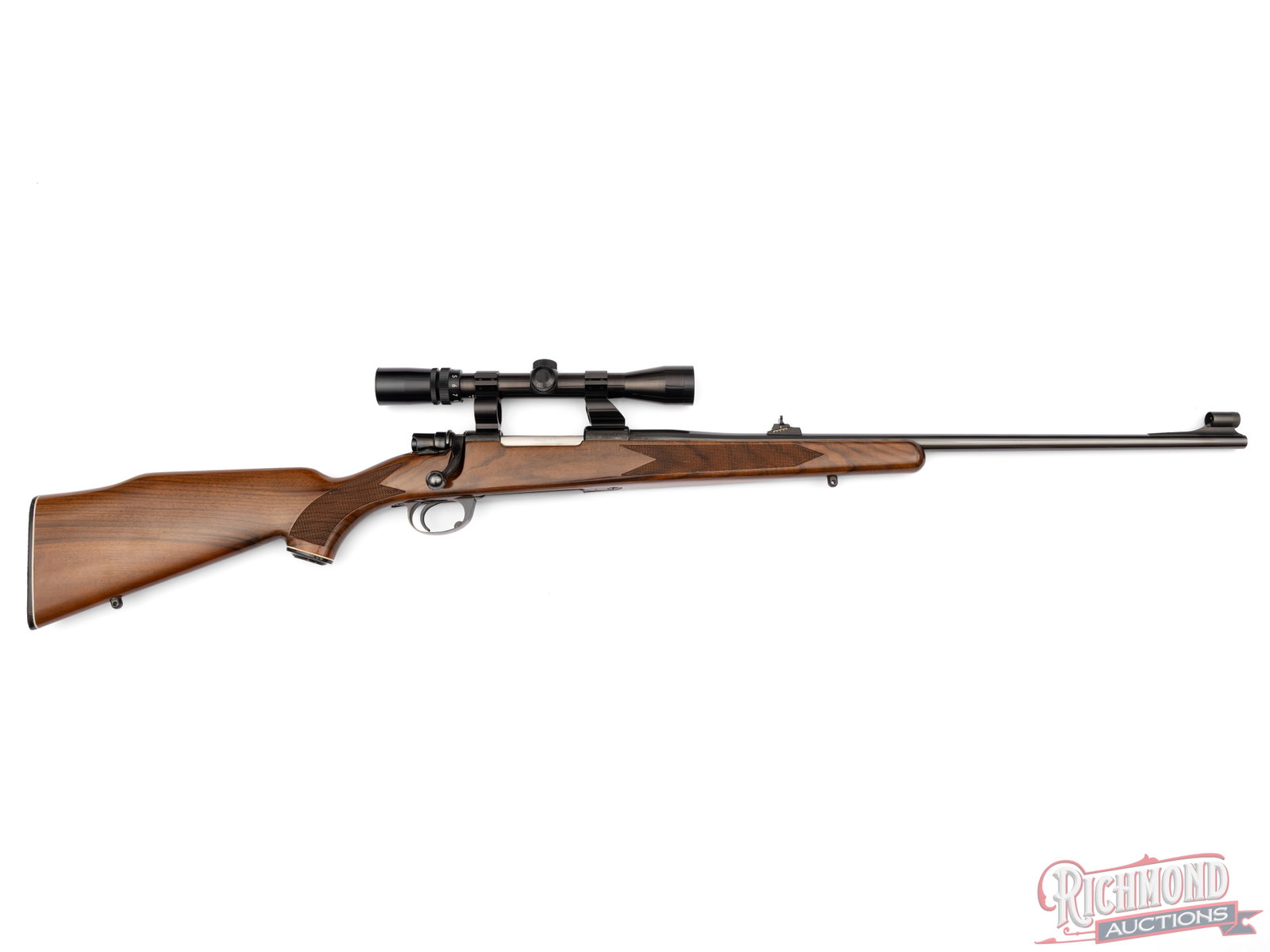 Zastava Interarms Mark X Mauser Bolt Action Rifle .30-06 SPRG With Bushnell Scope: Manufactured by Zastava Arms and assembled in England for Interarms circa 1990's. Features a 24" blued tapered barrel with rear adjustable notch and hooded ramped blade front sight. Comes equipped wit