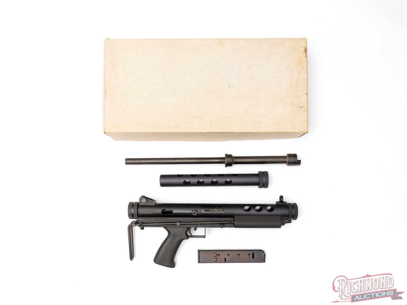 Feather Industries AT-9 Semi-Automatic 9mm Luger Survival Rifle In Original Box: Manufactured by Feather Industries Inc in Boulder, CO circa 1990. Lightweight and easy compactable makes this an ideal survival rifle. Features a 17" blued screw-in barrel. Rear adjustable peep sight