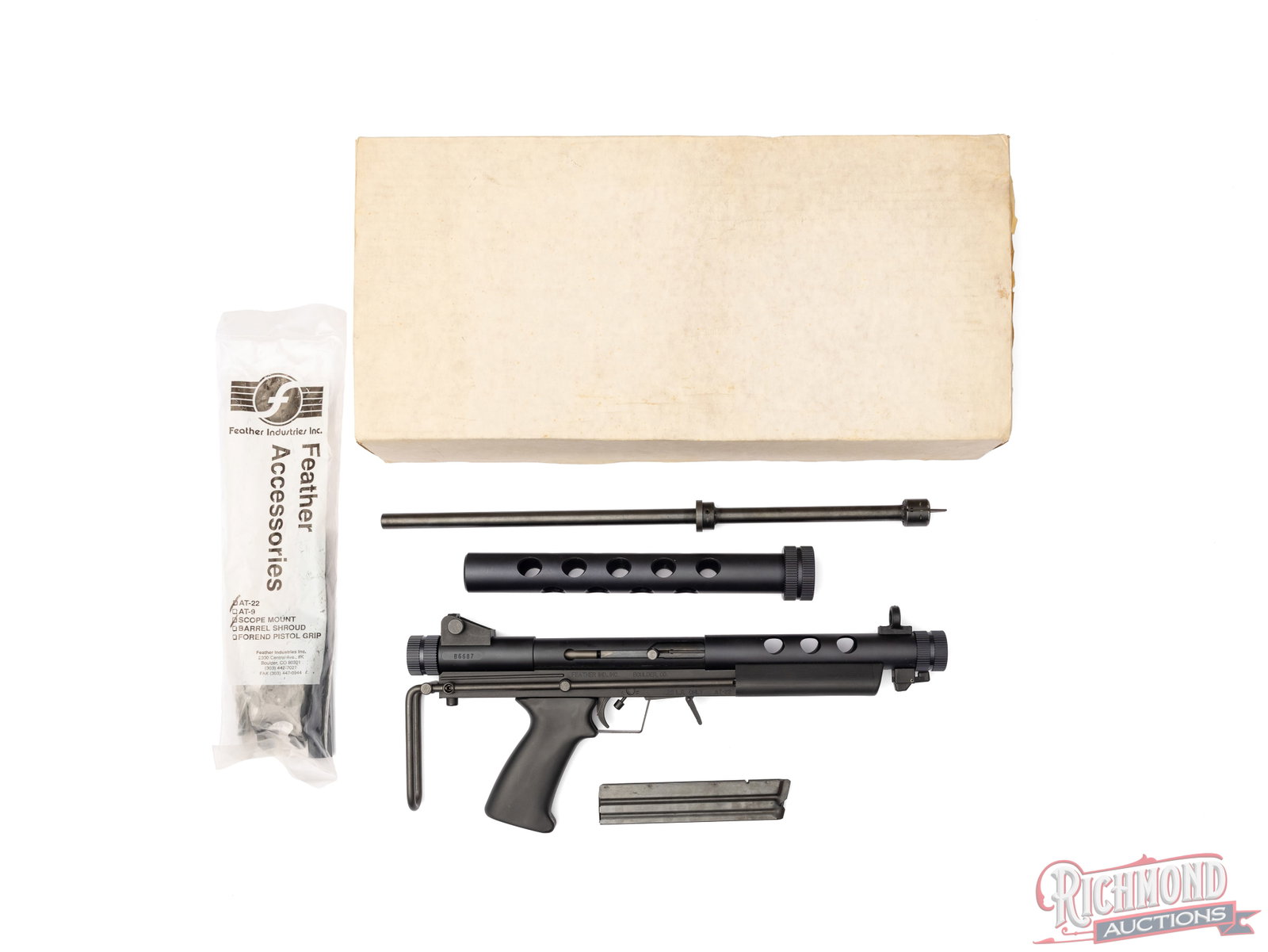 High Condition Feather Industries AT-22 .22 LR Semi-Automatic Survival Rifle in Original Box: Manufactured by Feather Industries Inc in Boulder, CO circa 1990. Lightweight and easy compactable makes this an ideal survival rifle. Features a 17" blued screw-in barrel. Rear adjustable peep sight