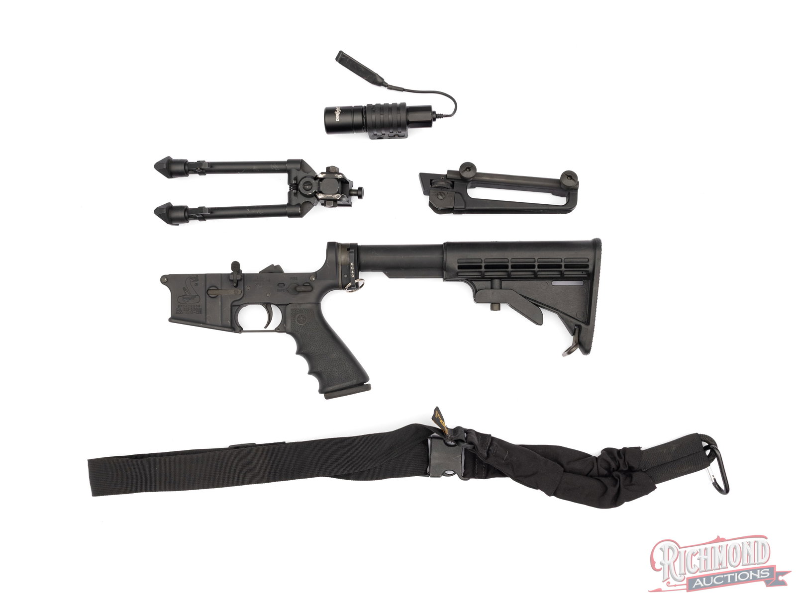 Bushmaster XM15-E2S Complete Lower Receiver W/ Accessories: This lower receiver was made by BFI in Windham, ME. It is fitted with a Houge textured rubber pistol grip and sling loop behind the receiver. Included with this lower receiver is an NcStar bipod,