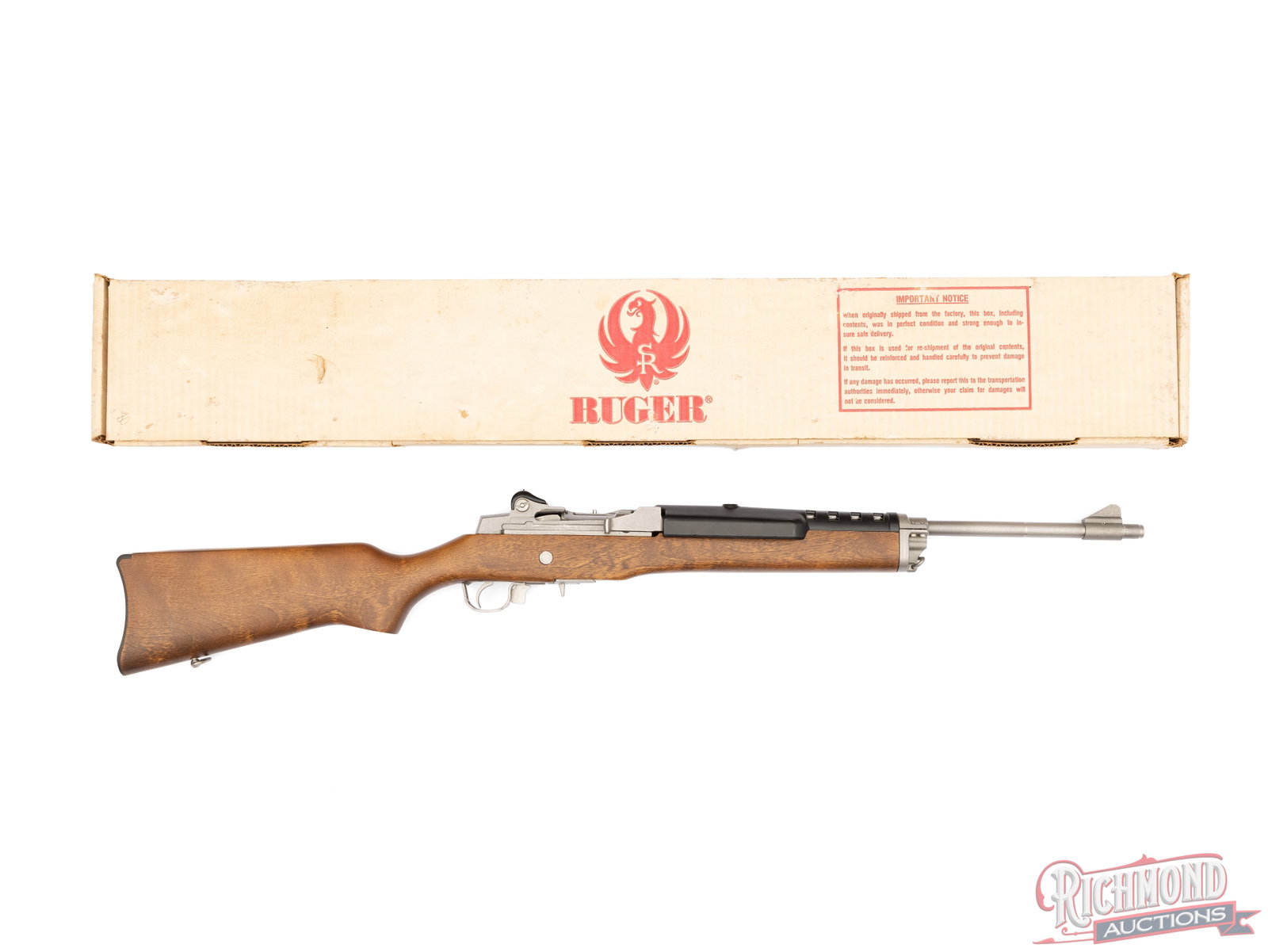 Ruger Mini-14 .223 REM Semi-Auto Rifle With Factory Box: Manufactured by Ruger in 1989. Features an 18" matte stainless barrel with a blade front sight an adjustable rear peep. Garand style action with trigger guard safety lever. Fitted with a one piece
