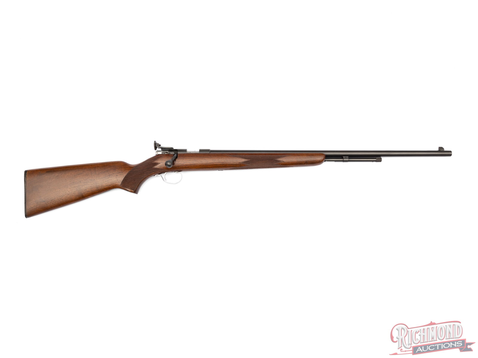 Winchester Model 72A Bolt Action Rifle In .22 Short / Long / LR: Manufactured by Winchester between 1939 and 1958. Features a 25" blued round barrel with receiver mount adjustable peep sight and dovetailed front blade. Bolt action with manual safety and a 2/3