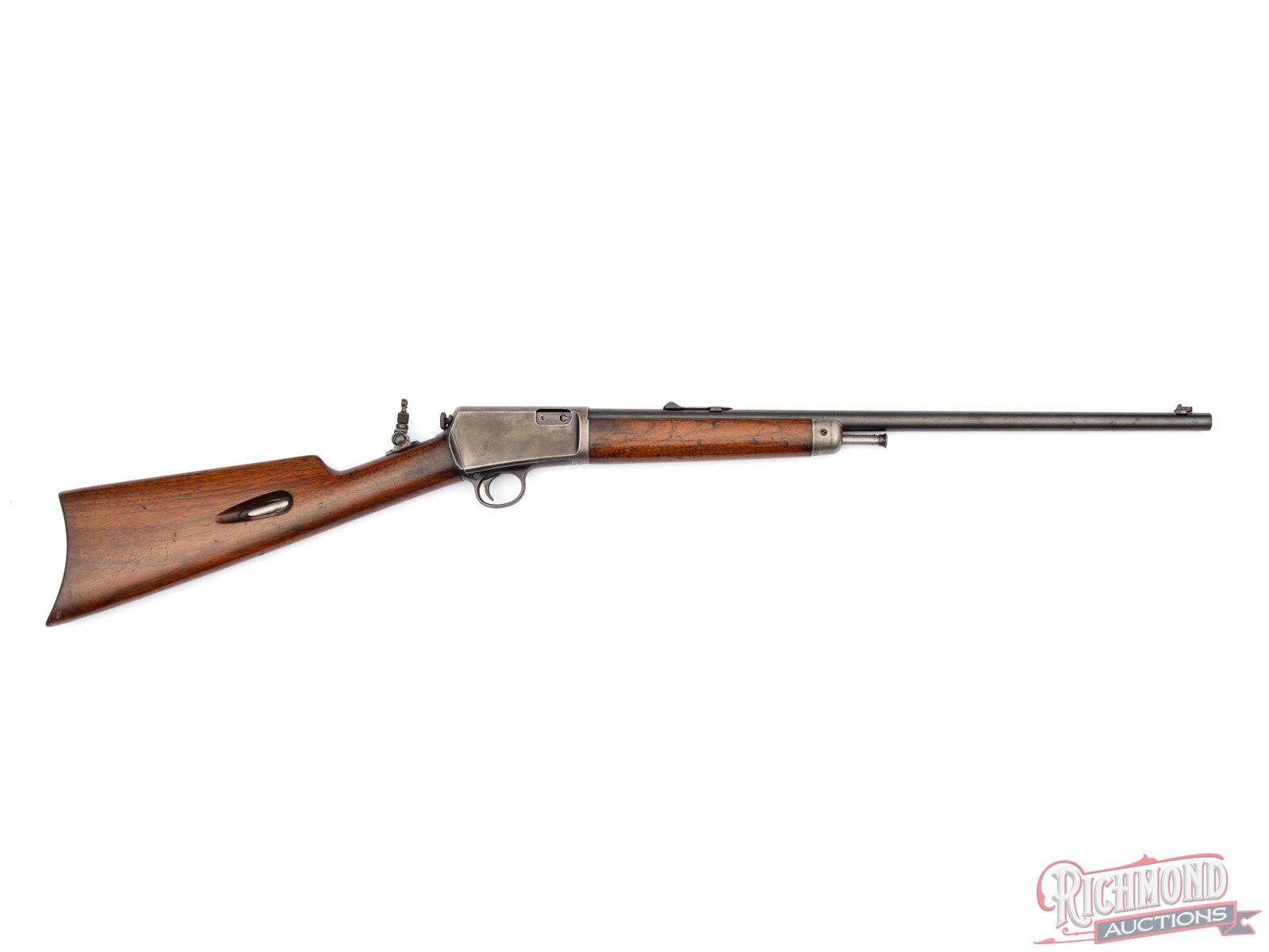 1909 Winchester Model 1903 .22 Win Auto Semi-Automatic Rifle: This model 1903 rifle was manufactured in 1909 by Winchester Repeating Arms in New Haven, CT. Features a 20" blued round barrel with two-line Winchester address. Rear notch sight, tang mounted
