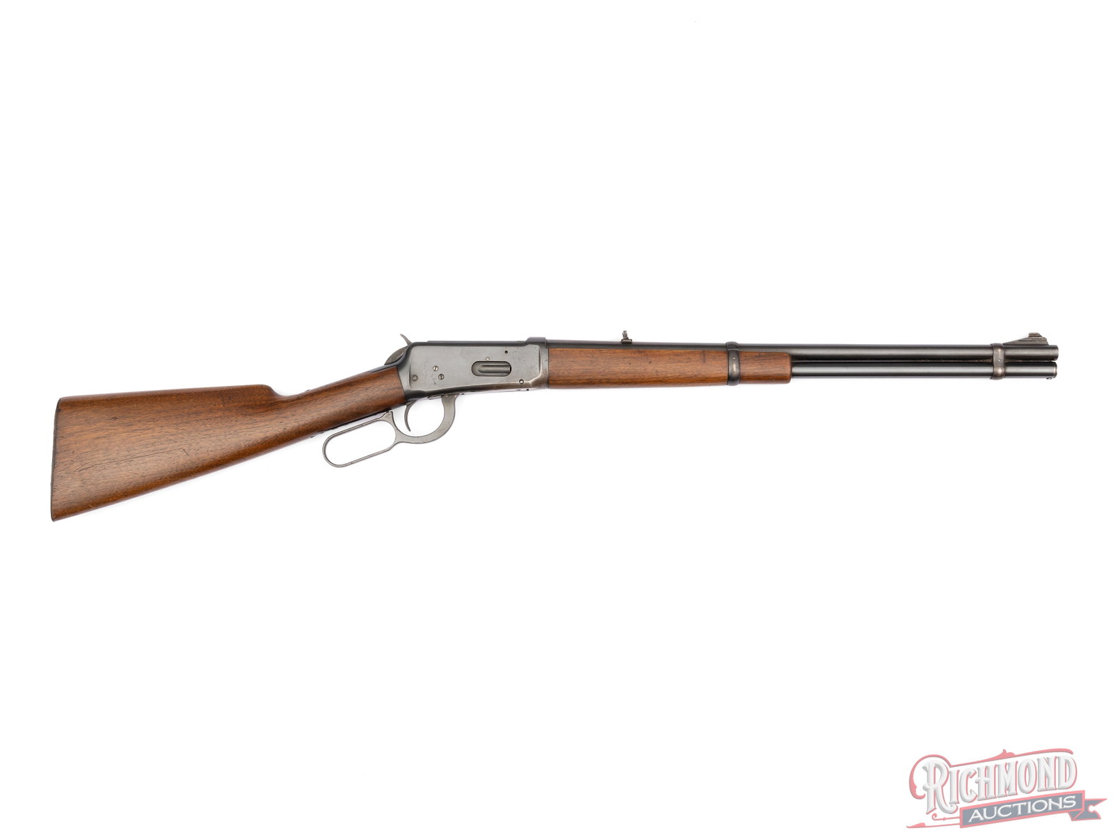 Pre '64 Winchester Model 94 Lever Action Carbine in .32 WS: Manufactured by Winchester Repeating Arms Company in 1942. Rifle features a blued Winchester Proof steel 20" round barrel with rear flip-up leaf sight and ramped front blade sight, missing the hood. B