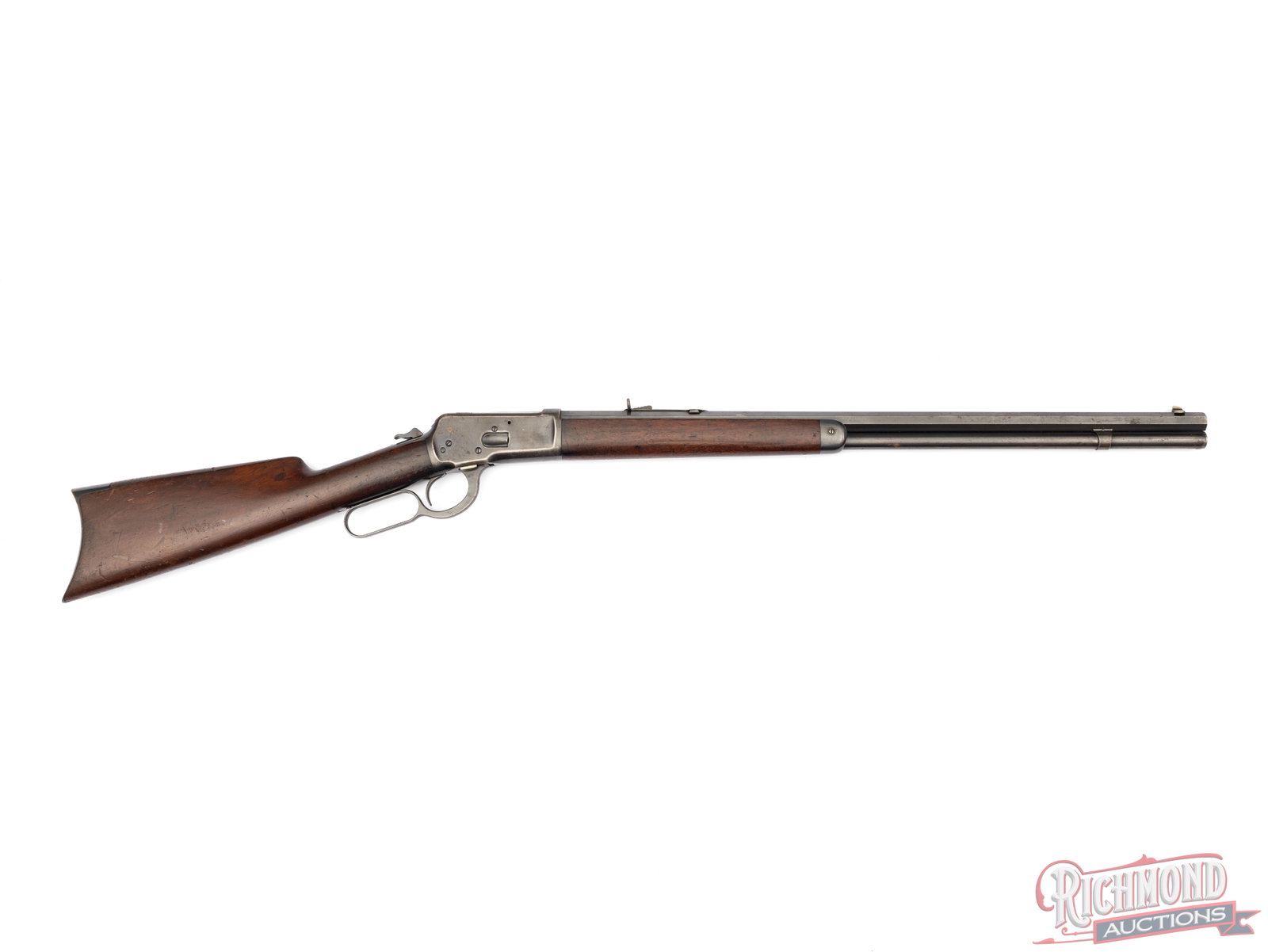 Antique Winchester Model 1892 Lever Action Rifle In .38 WCF: Manufactured by Winchester in 1893. Features a 24" blued octagon barrel with rear semi-buckhorn adjustable notch and dovetailed front blade. Full barrel length magazine tube chambered for .38