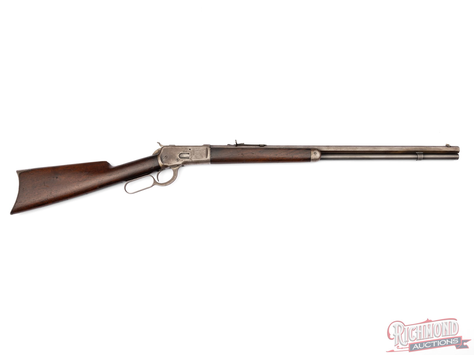 Antique Winchester Model 1892 Octagon .38 WCF Lever Action Rifle: Manufactured in 1893 by Winchester Repeating Arms. Features a 24" blued octagon barrel with Buckhorn rear sight and blade front. Full barrel length magazine tube chambered for .38 WCF. Lever action