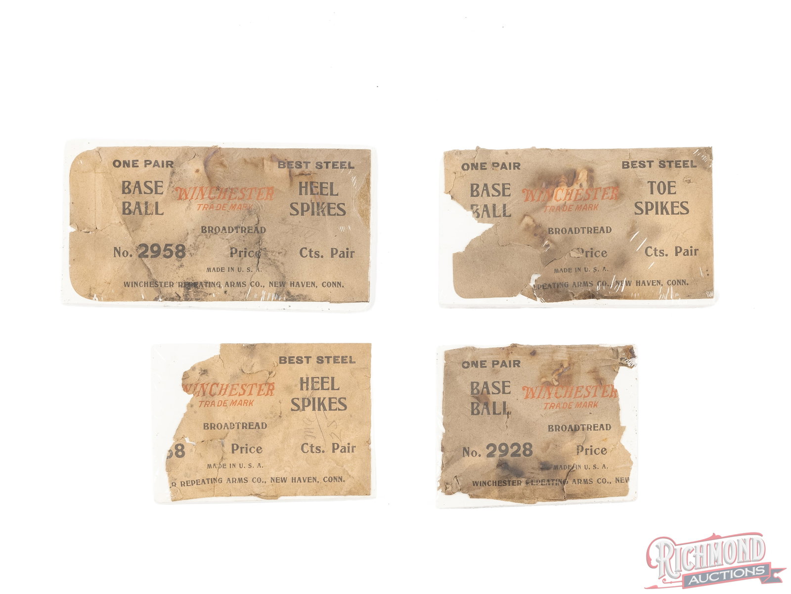 Four Winchester Baseball Cleats/Spikes Paper Packages: This lot contains four empty packages that each contained a pair of baseball toe or heel spikes. Packages have the red Winchester Trademark with the New Haven, Conn line at the bottom. Packages show