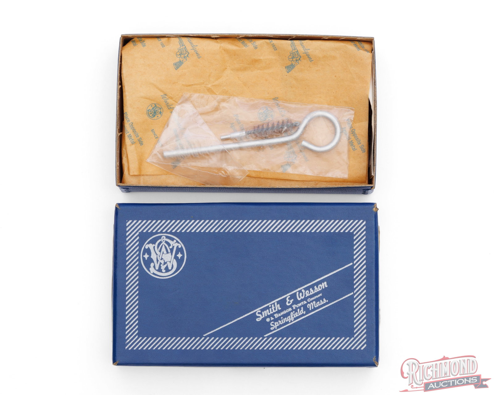 Smith & Wesson Factory Box For Model 34-1 Revolver: This two piece box was for a model 34-1 revolver made by Smith & Wesson. The box measures 7 1/2"x4 1/4"x 1 1/2". The box contains the wax paper, cleaning rod with wire brush and original paperwork.