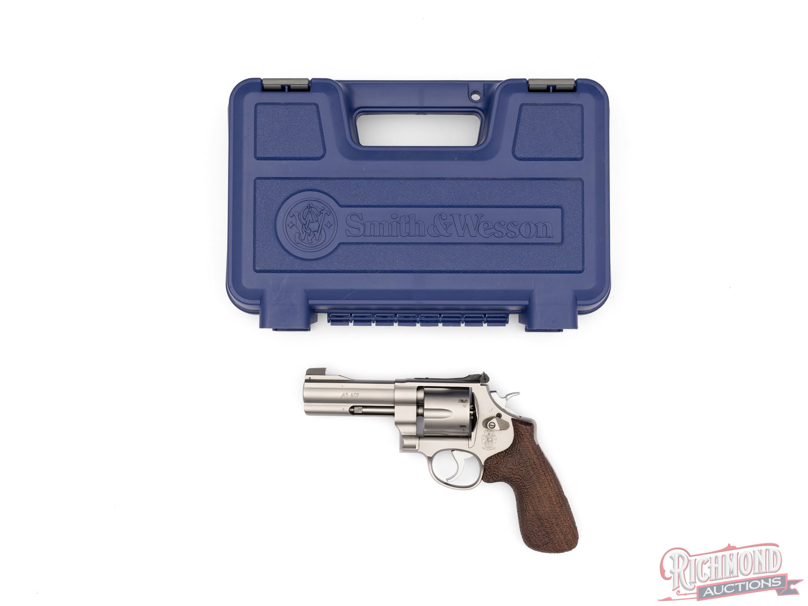 Smith & Wesson Model 625-8 Double Action .45 ACP Revolver With Accessories In Original Case: Manufactured by Smith & Wesson circa 2012. This revolver features a 4" barrel with rear micrometer adjustable notch and ramped blade with brass bead front sight. Full barrel length underlug.