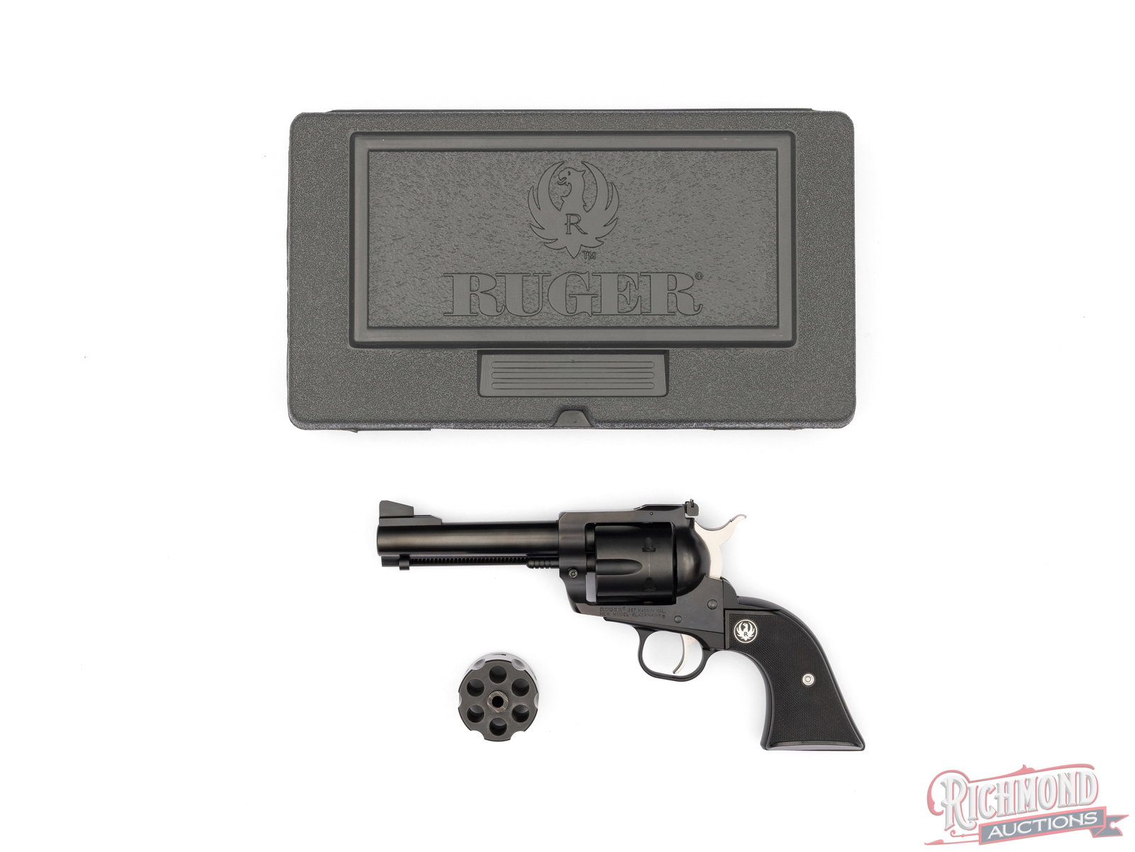 Ruger New Model Blackhawk Single Action .357 MAG & 9mm Revolver In Original Case: Manufactured by Ruger in 2014. Features a 4-3/4" barrel with rear micrometer notch and ramped blade front sight. Single action with a six round fluted cylinder chambered for the .357 Magnum and a seco