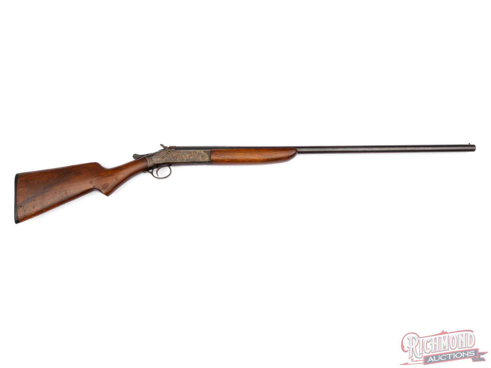 Iver Johnson & Cycle Works Champion 16 Gauge Single Shot 30" Shotgun: Manufactured by Iver Johnson Arms & Cycle Works. Features a 30" blued barrel with brass bead front sight. Full choke with a 2-3/4" chamber. Case hardened break action, single shot with exposed