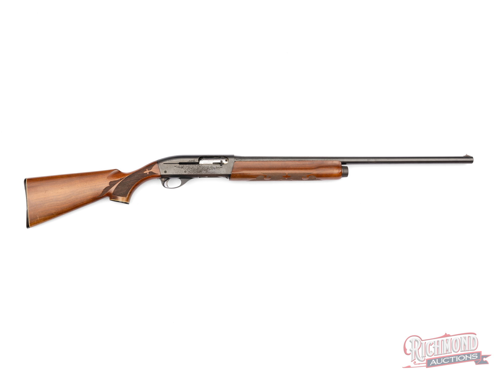 Remington Model 1100 Semi-Automatic 12 Gauge Shotgun: Manufactured by Remington Arms Company in Ilion, NY. It features a factory blued 26" barrel with nickel bead front sight. Chambered for 2-3/4" shells or shorter with an Improved Cylinder choke. Grade
