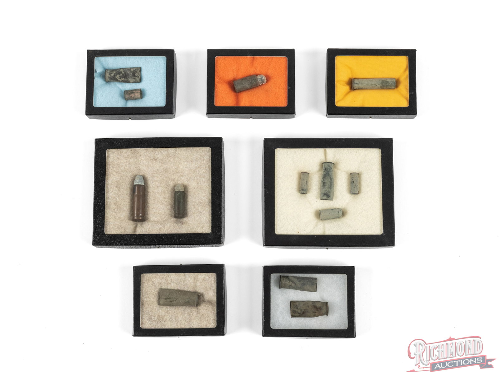 Seven Display Boxes of Vintage Cartridges And Shells: This is a lot of 7 different small display boxes in different used cartridges in dug up condition. There is one box that contains a 45-70 complete cartridges and 45 colt cartridge. The used casings