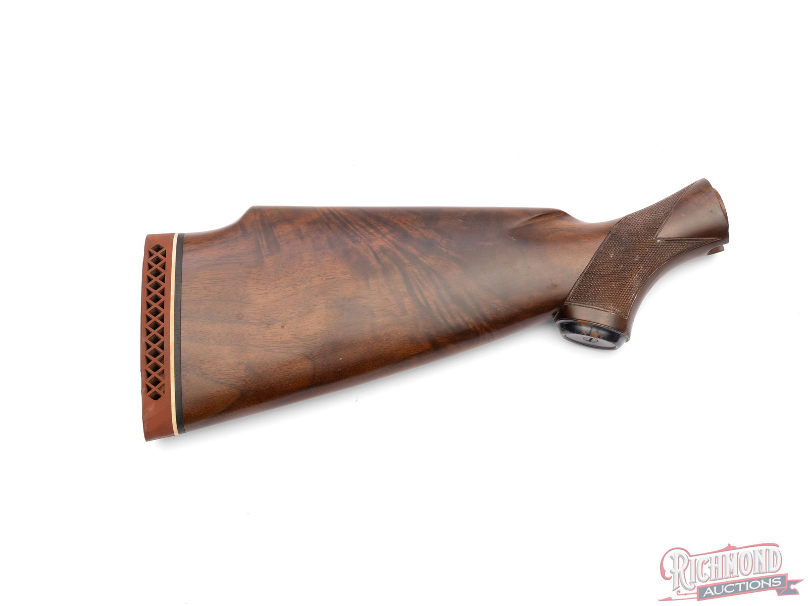 Winchester Wooden Stock With Recoil Pad: This Winchester stock is fitted with a hard black butt plate and checkered grip. It measures 14 1/2" long at its longest point. Condition GOOD
