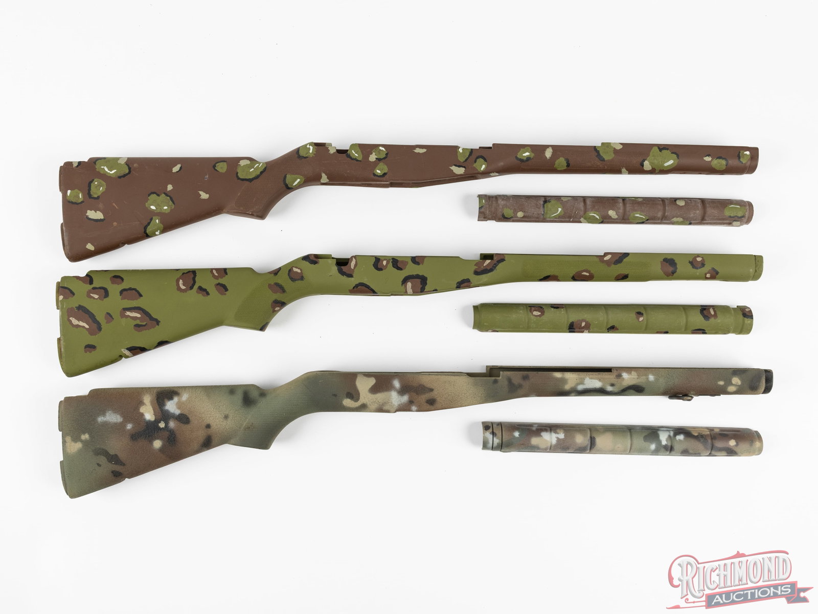 Set of 3 M-14 Rifle Stocks With Custom Camouflage Pattern: In this lot is three composite stocks and fiberglass upper hand guards for the M14 rifle. Each of these stocks has a matte finish custom hand painted camouflage pattern. Each stock is fitted with an