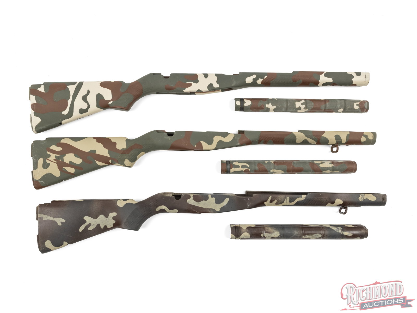 Set of 3 M-14 Rifle Stocks With Custom Camouflage Pattern: In this lot is three composite stocks and fiberglass upper hand guards for the M14 rifle. Each of these stocks has a matte finish custom hand painted camouflage pattern. Each stock is fitted with an