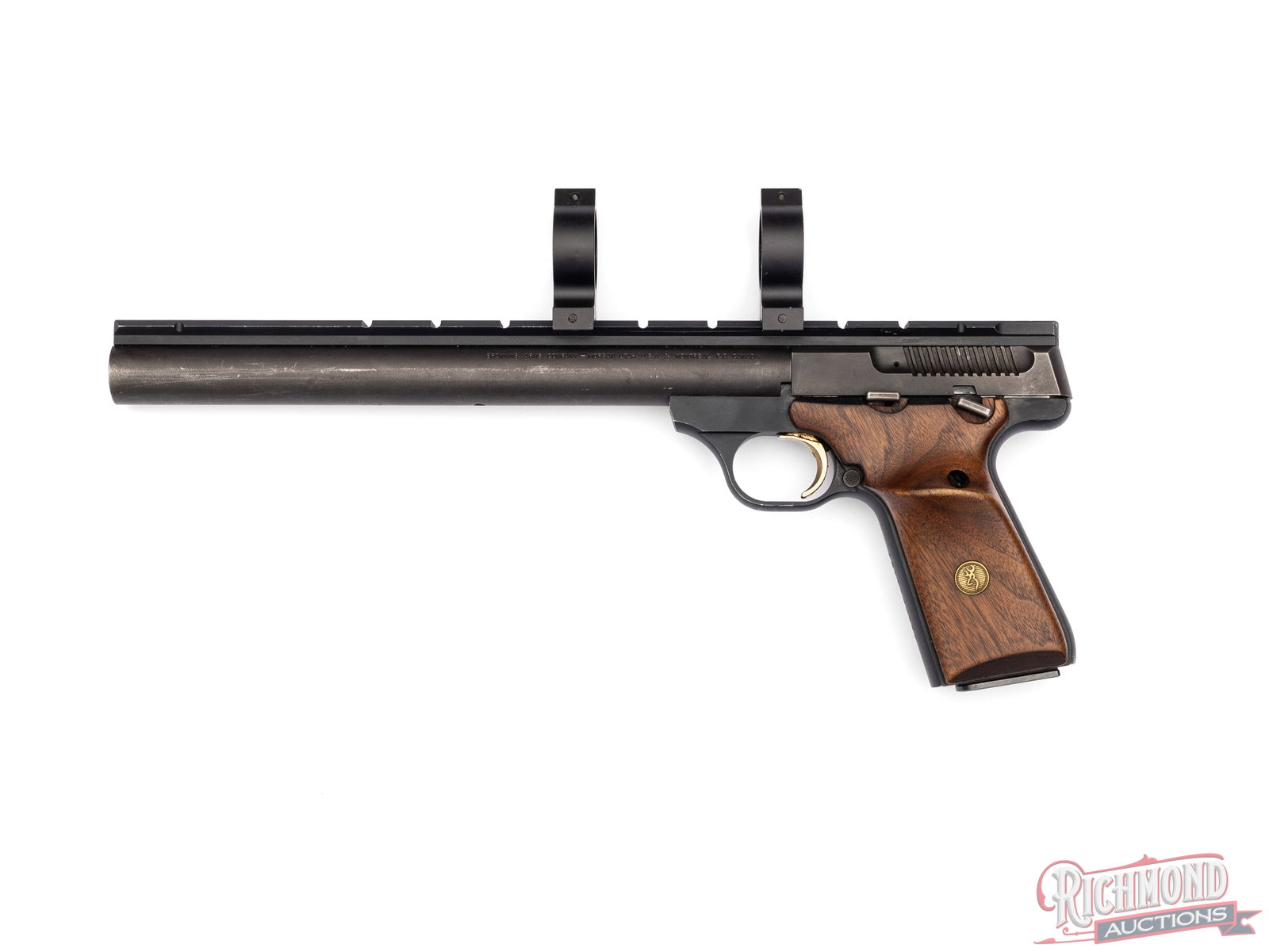 Browning Buckmark 9-1/2" Bull Barrel .22 LR Semi-Automatic Target Pistol Scope Ready: Manufactured by Browning in the USA in 1988. This target pistol features a 9-3/4" matte finish bull barrel. Optics ready with a full length Picatinny rail and scope rings. Semi-automatic action with