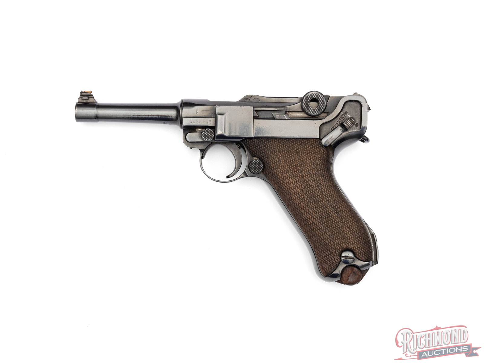 1915 DWM Mauser P-08 Luger 9mm Semi-Auto Pistol: Manufactured by DWM/Mauser Oberndorf in Germany in 1915. The serial number matches all parts visible except the magazine, not stamped. Features a 4" tapered barrel with rear notch sight blade. "DWM"