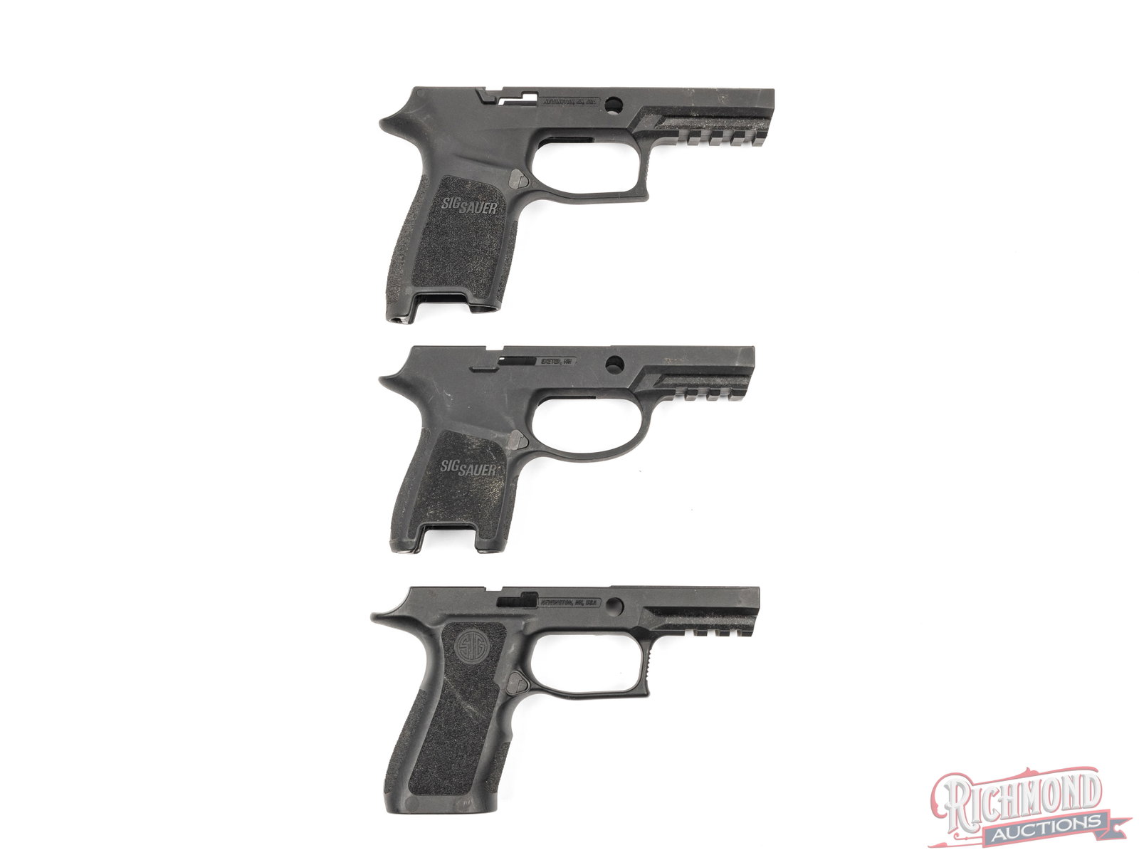 Lot Of Three Sig Sauer Grip Modules For Sig Pistols: Three grip modules for Sig Sauer pistols. One appears to be for the P320 Sub-compact in small-medium. One P320 compact in medium and one for the P320 Xcarry in medium. All are equipped with mag